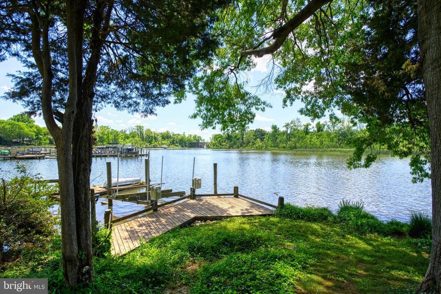 WOW!!  RARELY AVAILABLE --Over 1/2 acre Water Front Lot on Little Hunting Creek with quick access under the Stone Bridge to the Potomac River.  Owner can by right build a long dock as the neighbors have done.  Larger boats welcome! See docs for information. GORGEOUS water views from  back of home** Lovingly  maintained &  Updated since 1971** Fantastic floorplan  approx. 4,000 sq ft- Spacious rooms throughout!  Formal living and dining rooms - Gorgeous Hardwood floors on 2 levels**Updated kitchen with Cherry Cabinets , Corian Counters, Large Pantry - Spacious table space & Water Views from Bay Window* Main floor Family room with Masonry wood burning Fireplace - New Carpeting, Pella door & Water Views* HUGE primary bedroom  - see the water from your BED!!  2 walk-in closets**Large Sitting Room with WATER VIEWS** Spacious 3 additional Bedrooms - all have ceiling fans &  Lovely hardwood floors - 2 with Water Views** ALL baths beautifully renovated  2020** Entire home Freshly painted**  NEW ROOF in 2015, NEW electric service panel 2023, Water heater 2016, Full HVAC system replaced, Oversized screened gutters, Garage door replaced ** Upper level windows replaced**Beautiful lower level 2nd Family room has side door to rear yard +NEW carpeting**There is space to add a bath on the lower level** 24,626 sq ft lot - rear yard has expansive lawn, towering trees** Raised brick walled patio from main family room PLUS 2 stone block patios!!  This is the very best PARTY home or just relax and enjoy the quiet!  Incredible location in desirable Fort Hunt  - quick access to George Washington Parkway - where you can run, take long walks, visit Mount Vernon Estate. 10 minutes to Old Town Alexandria, short commute to The Pentagon, Fort Belvoir, Huntington Metro - OR use popular 11Y quick Bus to DC.