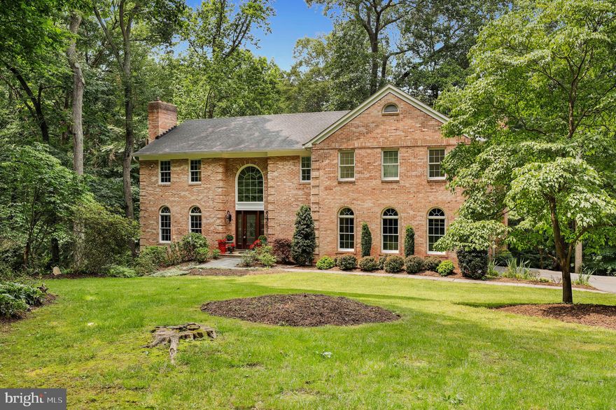 Opportunity awaits in Potomac’s sought-after River’s Edge community! This stunning custom all-brick and stone estate is set on a tranquil 1.5-acre lot at the end of a quiet cul-de-sac, offering nearly 6,000 square feet of finished living space and a driveway with ample parking. Inside, this beautifully maintained classic Colonial offers exceptional craftsmanship and thoughtful updates by the original owner, including a few of the following new items: roof, soffits, eaves, peaks, windows, French doors, HVAC system, hot water heater, and custom blinds. The main level welcomes you with a two-story grand foyer, formal living and dining rooms, study, and a warm and inviting family room with a raised hearth stone fireplace and gorgeous views of the treed backyard with private access to Pennyfield Lock 22 of the C&O Canal where President Grover Cleveland spent time fishing during his presidency and after retirement. The kitchen is expansive and bright with updated countertops, sink, and stovetop, high-end cabinetry, and a center island, ideal for both entertaining and everyday living. Rich hardwood floors grace both the main and upper levels.
Upstairs, the primary site is a luxurious retreat featuring skylights, a fireplace, a Juliet balcony, a spacious walk-in closet, and an updated primary bathroom. The upper level also offers four additional bedrooms and three updated full bathrooms, providing ample space for family and guests.
The lower level is fully finished and offers additional flexibility with one bedroom, a full bath, a large recreation space, and ample storage space.
Located in the picturesque River’s Edge community, residents enjoy three scenic trails that lead directly to the C&O Canal towpath, with convenient access to major highways, shopping, dining, and more.