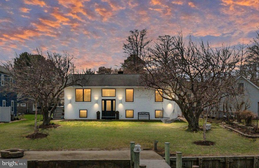 A Waterfront Retreat on the Chester River! Wake up to glowing Sunrises, unwind to painted Sunsets and savor the Peaceful rhythm of life on the Waters of the Chester River. This beautifully renovated Home offers 75 feet of waterfront and a rare lot‑and‑a‑half setting comfortably outside the flood zone, giving you both serenity and security. Inside, the Home feels warm and welcoming from the moment you step in! With 4 Bedrooms, including a spacious primary en‑suite, and newly renovated Bathrooms, every space has been thoughtfully Updated for comfort and ease. The heart of the Home is the stunning Chef’s Kitchen, where a Large Quartz island invites gathering and conversation with Picturesque Views of the Water! A Wolf gas Cooktop, Vegetable Sink, Wolf Steam Convection Oven, Microwave Drawer, Ceramic Farm Sink, Stainless Steel Appliances, Spice Drawer and leathered Granite countertops make cooking a true joy! Custom Walnut Cabinetry and Hardwood floors add timeless charm throughout. Downstairs, the cozy Family Room becomes the perfect gathering spot with its Wood‑burning stove, custom Wainscoting and a Quartz ledge that frames the Water Views like Artwork. Additional highlights include Custom Closets, Recessed Lighting, Ceiling Fans and a spacious Laundry Room. Updated white Vinyl Board-and-Batten Siding with cylinder lighting create a mesmerizing view as you come home by boat or walking back to the house from a night on the Pier! New high‑end black "Marvin" Casement windows fill the home with natural light, while a New Trane HVAC System keeps everything comfortable year‑round. Step outside and you’ll find a wraparound Teak Deck overlooking the Water, an ideal place for morning coffee, evening wine and enjoying all of those Crab Feasts! The yard is a Gardener’s delight, with mature Cherry Blossoms, a Fig Tree, a White Peach Tree, raised Garden Beds and Grapevines draped over an Italian‑inspired Arbor. Three outdoor Sheds and a Dock Box provide plenty of storage for tools, gardening and waterfront gear. The 130' Pier with L-Deck is ready for your adventures, complete with Copper capped Pilings, High Speed Boat Lift, Jet Ski/SUP/small boat Lift, Swim Ladder and Lighting Stations with water and electricity! Whether you love Crabbing, Fishing, Boating, or simply watching the River drift by, this property brings Waterfront Living to Life! Osprey, Blue Heron, Green Heron, Bald Eagles, Purple Martins, Dolphins, Buffleheads, Mallards, Rockfish, Blue Crabs and many more Wildlife will keep you entertained throughout the Seasons! The Chester River Beach Community adds to the charm with events like a 4th of July Parade, Chili cook‑off, Easter Egg Hunt, Santa visits, Holiday Lights contest, Halloween festivities and Movie nights in the Park! You’re also just a short Boat ride to the Narrows for Waterfront Dining, Rock Hall for your crab feasts and St. Michaels for all the shopping and Maritime fun! Take a quick bike ride, walk or run to the Kent Island Cross Trail and an easy drive to local Restaurants, Boutiques, Parks, Beaches and Marinas. A turnkey Waterfront haven with deep water, sweeping panoramic views and thoughtful upgrades throughout... this is the Waterfront Lifestyle you’ve been Dreaming of! **OPEN HOUSE SATURDAY 3/21/26 11am to 1pm**