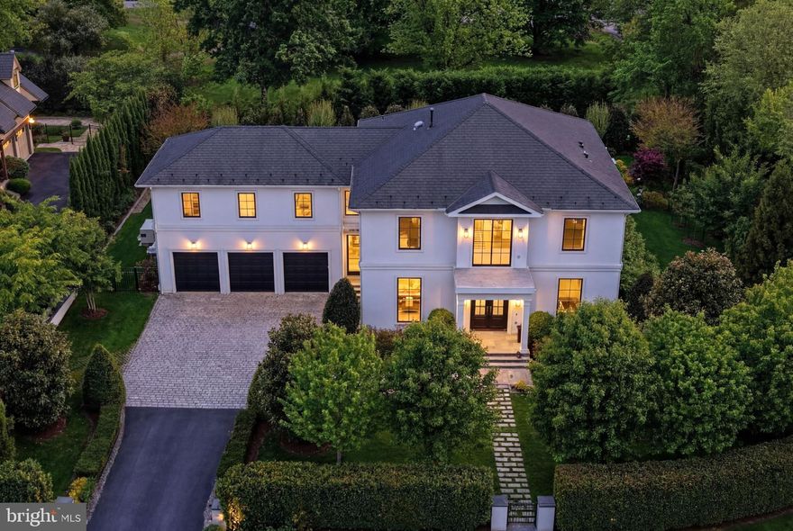 Just minutes from Washington, DC, this stunning McLean estate presents a modern interpretation of classical architecture with exceptional craftsmanship throughout. Newly built in 2018, the light-filled interiors offer a seamless flow from formal spaces to an open-concept kitchen, breakfast room, and living room overlooking private rear gardens and a swimming pool.  The south facing rear garden exposure allows the entire back of the house to be flooded with sunlight!    

The chef’s kitchen features custom European cabinetry and professional-grade appliances, while the primary suite provides a serene retreat with a newly renovated bath, heated floors, and dressing room with dedicated washer/dryer. Outdoor amenities include walkout level patios, a screened porch with retractable screen, and a saltwater pool. The house also includes a Whole-House Generator. 

The reimagined lower level is permitted as a separate Accessory Living Unit (ALU) with a second kitchen, bedroom, full bath, additional powder room, and flexible living spaces. An elevator services all levels, complemented by an oversized three-car garage and a prime location close to downtown McLean.