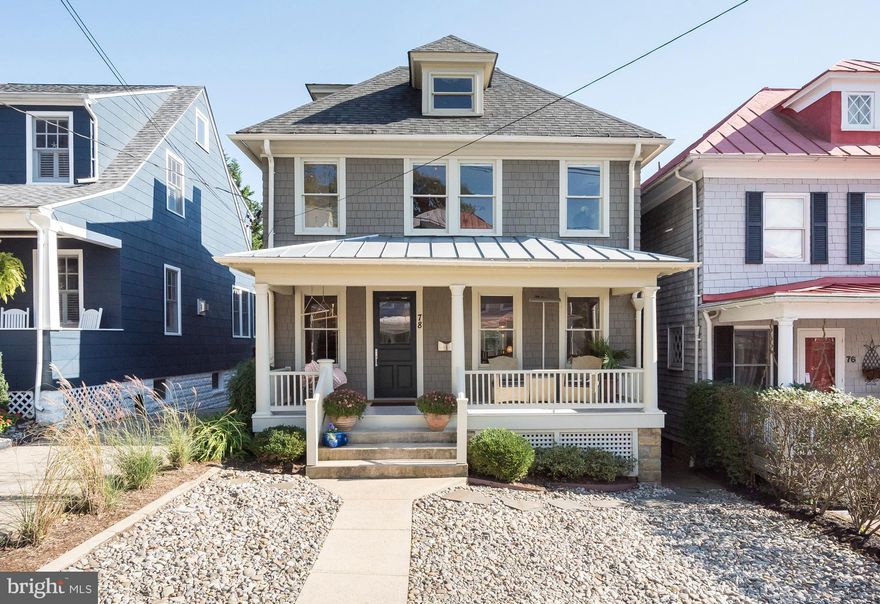 Stunning home in Historic District with parking for 2+ cars, front porch, fenced rear yard with raised brick patio & professionally landscaped. Views of Spa Creek from the rooftop deck.  Contemporary on the inside and traditional on the exterior. 4 Levels of finished space.