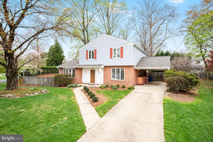 This spacious split-level offers a perfect blend of classic elegance and modern comfort. Nestled on a spacious 0.27-acre lot with fenced backyard, this well-maintained brick and siding home boasts three finished levels of inviting living space, ideal for both relaxation and entertaining. Step inside to discover a warm and welcoming interior featuring beautiful refinished hardwood floors. Enjoy cozy evenings by the wood-burning fireplace in the family room or primary bedroom or unwind in the jetted tub of the remodeled hall bathroom. With four generous-sized bedrooms and four remodeled bathrooms, including two full and two half baths, there’s plenty of room for everyone. Additional features include two fireplaces with mantels, recessed lighting, four ceiling fans, cathedral ceiling with skylight in living room, and upgraded double-pane windows that enhance energy efficiency. The finished basement is the perfect place to watch the big game and hang out with your friends at the custom built wet bar. The living space extends outdoors with a lovely patio, perfect for summer barbecues or peaceful mornings with a cup of coffee. The attached carport and concrete driveway provide convenient parking options. The property is conveniently located within approximately one mile of the Glenmont Metro Station, is less than one mile to the 11-acre Glenfield Park featuring large playground, picnic shelter, soccer field, tennis courts, and exercise station; and is within minutes of the Matthew Henson Trail, the Layhill Road exit for the ICC Highway, shopping, restaurants, schools, golf courses, and places of worship. We hope you enjoy your visit to this fantastic property!