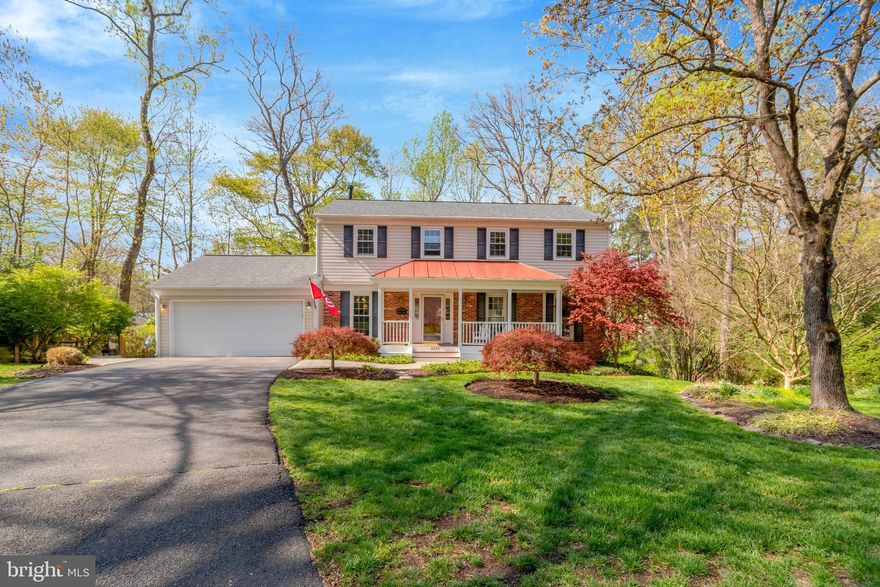 Welcome to a picturesque property nestled at the end of a quiet cul-de-sac in coveted Chapel Square! This four bedroom home with two full and two half bathrooms is a dream with its charming designer touches and thoughtful layout. A charming covered front porch invites you to this home and is perfect for enjoying your morning coffee. The main level welcomes you with a bright entryway and boasts an open yet intimate floorplan with great flow for entertaining between the living room, informal dining room, and kitchen. The living room features elegant new millwork wainscotting (2024) and the informal dining room has a stunning floor to ceiling brick fireplace with built-ins for a sophisticated charm! The eat-in kitchen features a breakfast nook with built-in bench seating in the bay window overlooking the lush backyard and  a spacious pantry. Transition into your formal dining room with designer wallpaper, newly installed built-in shelves, and a new stylish light fixture (2024). Off the main hallway you will find a beautifully renovated powder room with a new vanity, quartz countertop, and light fixture (2025). Enjoy the convenience of main level laundry with a new washer and dryer (2024) in your refreshed mudroom/laundry room that provides interior access to your two-car garage. The home is freshly painted and boasts refinished hardwood floors throughout (2024). The four bedrooms of the home are located on the upper level including a spacious primary suite. The primary suite features an amazing walk-in closet with a large dressing area, ensuite bathroom with large walk-in shower, and an additional and separate vanity sink with natural lighting! The secondary bedrooms are all generously sized with plenty of closet and storage space. The upper level hall bathroom has tons of natural light and features a new vanity, dual sinks, quartz countertops, mosaic tile flooring, and a new light fixture (2025). The lower level of the home features a large rec room, oversized storage room that is popularly converted to a fifth bedroom, and a half bathroom. The lower level is a walk-out with two entry/exit points both leading to your large ground-level patio situated under your deck. This Trex deck feels like you're in a treehouse overlooking your low-maintenance, fully fenced (2023), and beautifully curated backyard complete with custom stonework and tons of outdoor entertaining areas - large covered patio, grilling station, and storage shed - it's your personal oasis! Your expansive and private lot neighbors a wooded area and is conveniently located next to the walking path to the Wakefield Chapel Recreation Association community pool! Notable updates: HVAC (2021), roof (2018), windows (2005 - lifetime warranty), siding (2005), gutter guards installed (2023). Chapel Square is a well-established neighborhood in the highly desired Woodson/Frost/Wakefield Forest school pyramid. The neighborhood is located just outside of the Beltway and is surrounded by walking trails and parks. Conveniently located near lots of shopping, dining, and entertainment options alongside easy access to major commuter routes and public transit options!