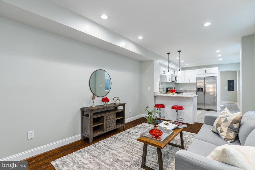 Large Three Story Row Home With A Oversized 2-Car Garage! Enter into a beautiful living area with refinished hardwood floors the seamlessly flow through the living and dining area.  Enter into a completely remodeled kitchen with custom white shaker cabinets, granite and stainless steel appliances. Also on the first floor is a half bath and laundry area.  On the second floor is a large master suite with ensuite bathroom, a second bedroom and an additional full bathroom.  On the third floor is a third huge bedroom with a high loft ceiling.  Enjoy a private fenced in back yard which leads to an oversized 2-car garage with a second story loft/storage area.  So many updates have been done so this home is ready to move right into!  House is vacant and easy to show so schedule your showing today!