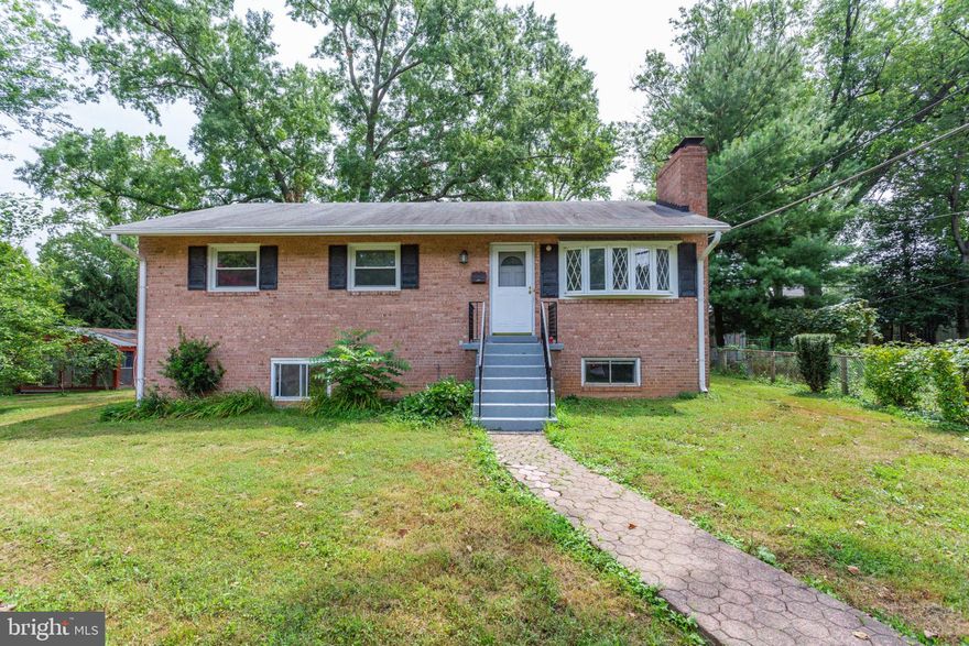 Spacious raised brick ranch on a large level lot in the City Of Falls Church. The raised ranch which is set back from the road  offers Great Elevation.   Every room has a view. Entertainment space in lower level with high ceilings walk out basement  plus an additional full bath and bedroom. Within a few blocks to Metro transit, restaurants and shopping. This Raised brick ranch has much to offer..3 full baths, 4 Bedrooms.. wood floors. Deck overlooking a flat fenced yard. Level driveway can fit 4 cars..So many living options. Rooms on lower level can be bedroom..offices..plus many large rooms on the main level..