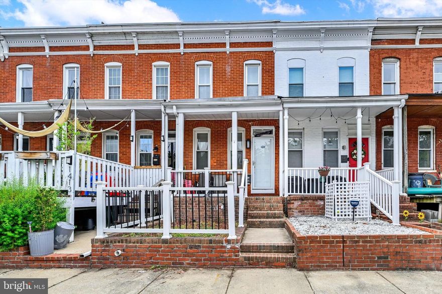 Live in the Heart of It All in the neighborhood of South Baltimore. Walk everywhere and take your pups! Wake up to stadium views and walk to the game. This updated Federal Hill rowhome puts you steps from M&T Bank Stadium and Camden Yards, with Hanover Street right around the corner right for an easy morning commute.  Three finished levels, off-street parking, and a layout built for the way people actually live.  This one checks boxes that are genuinely hard to find at this price point in Fed Hill. The main level sets the tone with hardwood floors, exposed brick, and an easy flowing floor plan. The kitchen delivers granite counters, stainless appliances, and soft-close cabinetry, functional, clean, and ready for Sunday brunch or a quick weeknight dinner before the game. A half bath and mudroom round out the level. Upstairs, the primary suite is your retreat after a long night on Cross Street, complete with access to a rear deck for morning coffee or late-night unwinding. A second bedroom and full hall bath give you flexibility for a roommate, guests, or a home office setup. The lower level is where this home really earns its keep. Two bonus rooms, use them as bedrooms, a gym, a studio, whatever the city life demands, plus a third full bath with a spa-style shower to relax in style. A rear parking pad means you're never circling the block after Ravens or Orioles traffic clears. Multiple outdoor spaces, including the front porch and rear 2nd story deck deck, let you take in the skyline on your own terms. The best Federal Hill has to offer is easily within reach.  Property is a short sale and sold strictly as-is and may include contents at closing. Short sale will be professionally negotiated by an experienced short sale team.