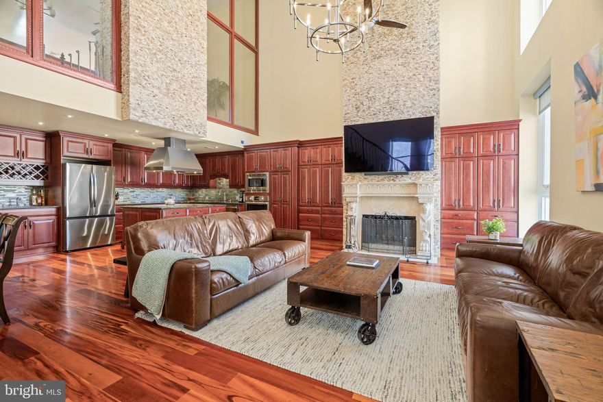 Newly listed in the heart of desirable Washington Square West, this exceptional residence is a true architectural masterpiece. A spectacular, must-see 2,400-square-foot, 3-bedroom, 3-bath bi-level condominium with one-car deeded parking, located within Philadelphia’s magnificent architectural crown jewel: The Musical Fund Hall.

The Musical Fund Hall at 8th and Locust was originally built in 1824 by the Musical Fund Society — one of the oldest musical organizations in the United States, founded in 1820 to promote music performance and support musicians in need. This iconic building holds the rare distinction of being designated on the National Register of Historic Places.

Completely reconfigured in 2017, this voluminous home offers breathtaking scale and drama, featuring soaring 28-foot ceilings, dramatic lofted spaces, towering windows with northern, western and eastern exposures and exceptional natural light throughout. The main living area occupies the original center of the historic music hall, where concerts were once performed.

Entertain effortlessly in the extraordinary great room, anchored by a working wood-burning fireplace, expansive dining area, and a chef’s kitchen equipped with an induction range, double Bosch ovens, custom cabinetry, and abundant pantry storage.

The main level includes two generously sized bedrooms, each with a beautifully appointed en-suite baths and large closets. The luxurious primary suite spans the entire upper level and features a spacious open sitting area with a wood burning fireplace overlooking the dramatic living room below and a huge walk-in closet. The primary 5 piece bathroom is a tranquil retreat, complete with an oversized glass-enclosed steam shower, dual vanities, and a deep soaking tub.

With remarkable scale, proportion, and architectural integrity, this home is perfectly suited for sophisticated urban living and entertaining. With a total of 13 residences, The Musical Fund Hall offers terrific privacy, security, and architectural distinction -- all with super low condo fees!

This is an unmatched opportunity to live within a nationally recognized historic landmark—where timeless architecture, cultural significance, and modern luxury coexist seamlessly. The hall has hosted many notable speakers and events, including the first Republican National Convention from June 17 to 19, 1856. Live Just steps from Washington Square Park, Talulah’s Garden, Jefferson and Pennsylvania Hospitals, Antique Row, Whole Foods, and convenient public transportation.