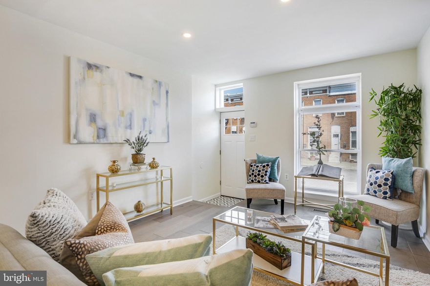 BRAND NEW 13+ FT WIDE RENOVATION NOW AVAILABLE! GLISTENING HARDWOODS CASCADE THROUGHOUT. ENJOY CUSTOM WHITE CABINETRY, UPGRADED TRIM AND PAINT PACKAGE, IMPORTED TILE, GRANITE COUNTERTOPS, SS APPLIANCES IN DESIGNER CHEF'S KITCHEN. TONS OF NATURAL LIGHT. FINISHED LOWER LEVEL. HIGH CEILINGS. TONS OF STORAGE. WALK-IN SHOWERS. WALK-IN CLOSETS. SPACIOUS 4 BEDROOMS WITH 2.5 BATHROOMS. PRIVATE REAR PATIO WITH GATE - GREAT FOR ENTERTAINING. CLOSE PROXIMITY TO RETAIL SHOPPING, LOCAL DINING, AND ALL MAJOR HIGHWAYS.