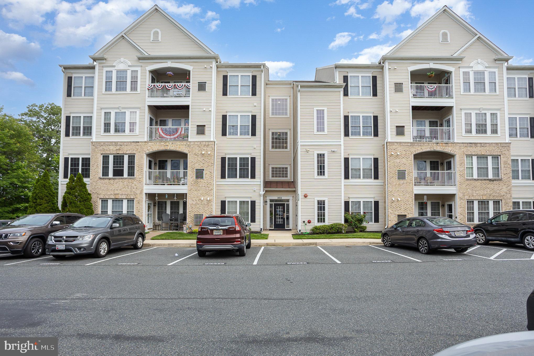 Welcome to this spacious and beautifully maintained 2-bedroom, 2-bathroom condo in the desirable 55+ Forest View Condo Community, offering one level living. Featuring 9-foot ceilings, hardwood floors in the foyer, elegant crown and chair molding in the dining room, this home blends classic details with modern convenience. The living room includes a ceiling fan and large windows, creating a warm and welcoming space. The eat-in kitchen has granite countertops, 42” maple cabinetry, gas stove, and recessed lighting—plus a bonus office nook for added flexibility. Step out onto your covered deck to enjoy your morning coffee. The laundry room is equipped with a washer, dryer, and built-in cabinetry for extra storage. The primary suite features a walk-in closet, ceiling fan, and a private bathroom with double vanity and stall shower. The second bedroom offers dual access to the hall bath. This unit is handicap accessible, making it ideal for guests or caregivers. Residents also enjoy access to a clubhouse, perfect for social gatherings, activities, and community events.