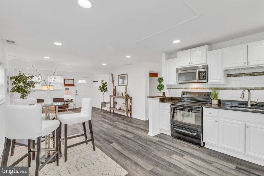 Beautifully presented 2 Bed/ 2 Full Bath Single Family Home with wooden floors and exquisite tilework along with recessed lighting throughout. Kitchen offers streamline white cabinet with brushed nickel knobs, and gorgeous granite countertop with a lovely backsplash tile to compliment. Backyard has well designed patio for entertaining. A Must See Home that shows with a touch of class.