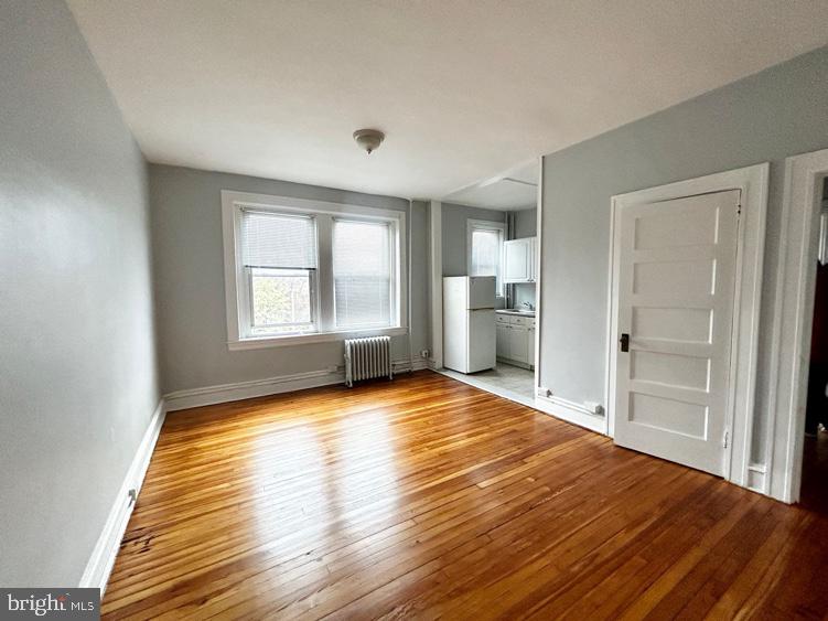 Live large in this oversized 3-bedroom, 1-bath apartment with high ceilings, refinished hardwood floors, and an open-concept layout perfect for relaxing or entertaining. Enjoy abundant natural light, a modern bathroom, and a kitchen with a gas stove and full-size fridge. Features include radiant heat, elevator access, coat closet, secure keyless entry, and Amazon Hub for packages.
Located in Hampton Court Apartments in Midtown Baltimore, just steps from MICA, UBalt, UMMC, and Mount Vernon. Easy access to Penn Station, Metro, Light Rail, and multiple bus lines. Students welcome. Virtual tours available.
Utilities not included. Flat monthly fee for heat/water. BGE separate.