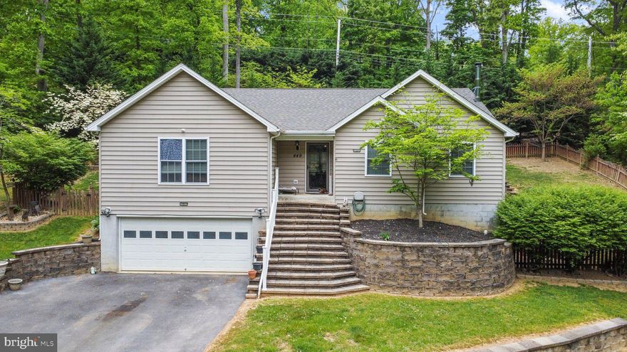 Charming raised rancher on private, wooded lot at the end of a quiet lane. Excellent location: the privacy of Shannondale without a long hike up a mountain, as this home is just off Mission Road. Imagine living on your own, unrestricted 0.81 acres. If you've been wanting to have a big garden or raise chickens, you can!
Plenty of parking, with the paved driveway and two car attached garage. Great backyard space, fully fenced with a deck. The main level features a family room with gas fireplace, three bedrooms, and 2.5 bathrooms. The basement has the potential to finish into a living area and already has a full bathroom. There is a walkout door to the backyard. Lots of recent improvements so you won't have to! Roof and HVAC replaced in 2018, water heater (80 gallons!) replaced in 2022, kitchen appliances replaced in 2018. Water softener in 2021, still under warranty. New carpet in living room and office (bedroom closest to front door)!  Located less than a quarter mile from Lake Shannondale, a private 55-acre lake with a beach and the Lakeside Bar & Grill. Close to hiking on Appalachian Trail and all the parks in Harpers Ferry. Did I mention no HOA? Schedule your showing or visit the open house on Sunday, May 28th, from 1-3 PM!