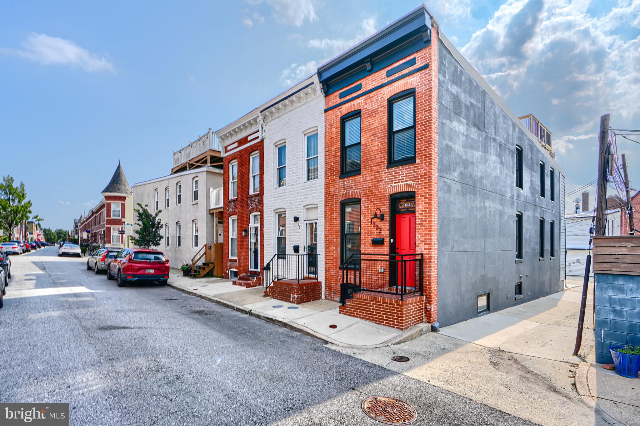Located on a charming block in Historic Federal Hill, 1302 Marshall Street is a beautifully renovated END OF GROUP, 3-level townhome offering the perfect blend of classic Baltimore character and modern convenience. With 3 bedrooms and 3 full bathrooms, including a finished lower-level suite, this home is ideal for those seeking both style and flexibility.
The main level features an open floor plan with hardwood floors, exposed brick, and a chef’s kitchen outfitted with stainless steel appliances, quartz countertops, and custom cabinetry. Upstairs, two spacious bedrooms each have their own en-suite baths and generous closet space.
Enjoy sweeping city views from the private rooftop deck, perfect for entertaining or unwinding. A private parking pad adds a rare and valuable convenience in the city.
Just steps to Cross Street Market, Federal Hill Park, the Inner Harbor, and some of Baltimore’s best dining and entertainment—this home offers the best of city living.