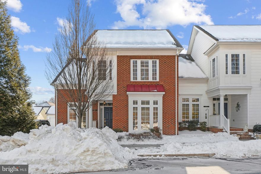 Beautifully maintained Colonial residence offering 3 bedrooms, 2.5 bathrooms, 2,674 finished square feet, and a 2-car garage in the desirable 55+ Ellicott Hills community. A welcoming front porch invites you into the main level, where hardwood floors flow throughout. The foyer opens directly into a private study or home office, featuring a charming arched wall cutout that provides sightlines into the formal dining room. The dining room is highlighted by elegant columns, chair rail detailing, and a timeless chandelier. Straight ahead, the open-concept great room impresses with soaring two-story vaulted ceilings and abundant natural light filling the family room. The gorgeous eat-in kitchen is thoughtfully appointed with an island with bar seating, stainless steel appliances, including a beverage refrigerator, granite countertops, white cabinetry, a classic subway tile backsplash, pendant lighting, and a pantry. A cozy breakfast area opens to the light-filled morning/sunroom, complete with skylights and exterior access. Down the hallway, you’ll find a convenient laundry closet with a washer and dryer updated in 2025, a stylish powder room, and interior access to the garage. The main-level primary bedroom offers plush carpeting, double closets, and a private ensuite bathroom featuring a dual-sink vanity, a soaking tub, and a separate shower. The upper level provides a versatile loft overlooking the family room, along with two spacious bedrooms and a full bathroom. Additional highlights include a versatile finished room over the garage with its own heating and cooling system, cathedral ceilings, and skylights, as well as a roof updated in 2023. Outdoor living includes a fenced side patio that extends to the rear of the home, ideal for relaxing or entertaining. Ellicott Hills residents enjoy access to community amenities, including a pool and common grounds.