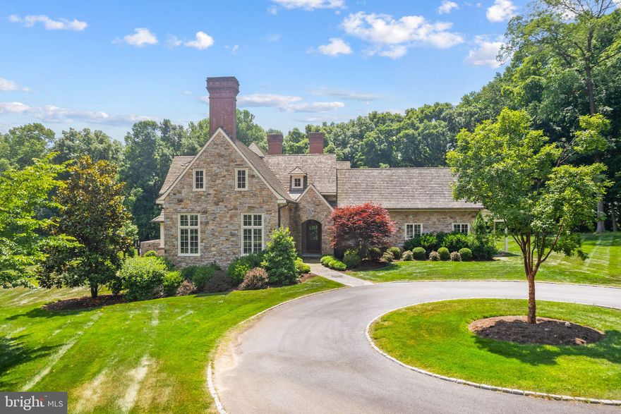 Introducing 356 Fairview Road, an exquisite English-country manor situated on 35 private acres in Chester County, PA. Inspired by the renowned architect Sir Edwin Lutyens, this distinguished residence, constructed in 2012, stands as a testament to timeless design and refined elegance.

Upon arrival, a picturesque country stone bridge marks the beginning of a serene half-mile private drive, leading you through scenic woodlands to the secluded estate. The manor, constructed with meticulously hand-cut, dry-laid stone, captures the artistry and craftsmanship in every detail.

The interior of the home offers a grand setting with four generously sized bedrooms and 4.5 bathrooms. Impeccably designed, the residence features hand-planed walnut floors and five fireplaces, each equipped with gas lines for convenience. The first floor is characterized by its impressive eleven-foot ceilings, expansive bay windows, exposed beams, and a coffered ceiling in the dining room, enhancing the grandeur of the space.

The gourmet kitchen features a spacious pantry and a butler's area, and is equipped with premium appliances, including Miele dishwashers, a Viking range, and a Sub-Zero refrigerator. The home is bathed in natural light, courtesy of French doors and oversized windows throughout.

The exterior offers perfect spaces for leisure and entertainment, including a 130 square foot terrace and a private deck accessible from the master suite. The detached 3-car garage includes a 900 square foot residential area with a separate entrance, providing additional versatility.

This property offers access to endless outdoor activities such as horseback riding, hiking, and biking. Just a short walk away, The Laurels Preserve offers over 900 acres of permanently protected natural beauty and rich local history. Once home to Native American fishing grounds and later used for mills and cattle grazing by the famed King Ranch, this serene landscape is now a conservation landmark. Protected by the Brandywine Conservancy, the preserve features scenic trails, lush pastures, and peaceful woodlands—perfect for nature lovers and outdoor enthusiasts alike.

Immerse yourself in the unmatched elegance and tranquility of this unique sanctuary at 356 Fairview Road.