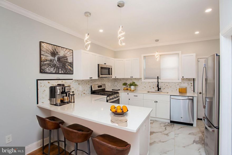 Welcome to 1847 Hoffman Street, a completely rehabbed South Philly gem offering 3 bedrooms, 1.5 bathrooms, and 1,200 sq ft of stylish living space. Step inside to an open layout with gorgeous new floors, recessed lighting, and a chef’s kitchen featuring sleek cabinetry, modern finishes, and a breakfast bar that’s perfect for your morning coffee or entertaining guests. Stay comfortable year-round with central AC, and take advantage of the semi-finished basement, ideal for a home office, gym, or playroom. Outside, the private concreted backyard provides the perfect low-maintenance space for relaxing or hosting BBQs. Nestled on a quiet block but just steps away from South Philly’s best restaurants, shops, and neighborhood favorites, this home blends comfort, convenience, and city lifestyle seamlessly.