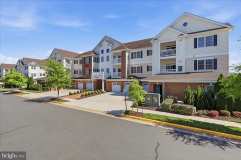 Photo of 15100 Heather Mill Lane #301, HAYMARKET, VA 20169 (MLS # VAPW2119852)