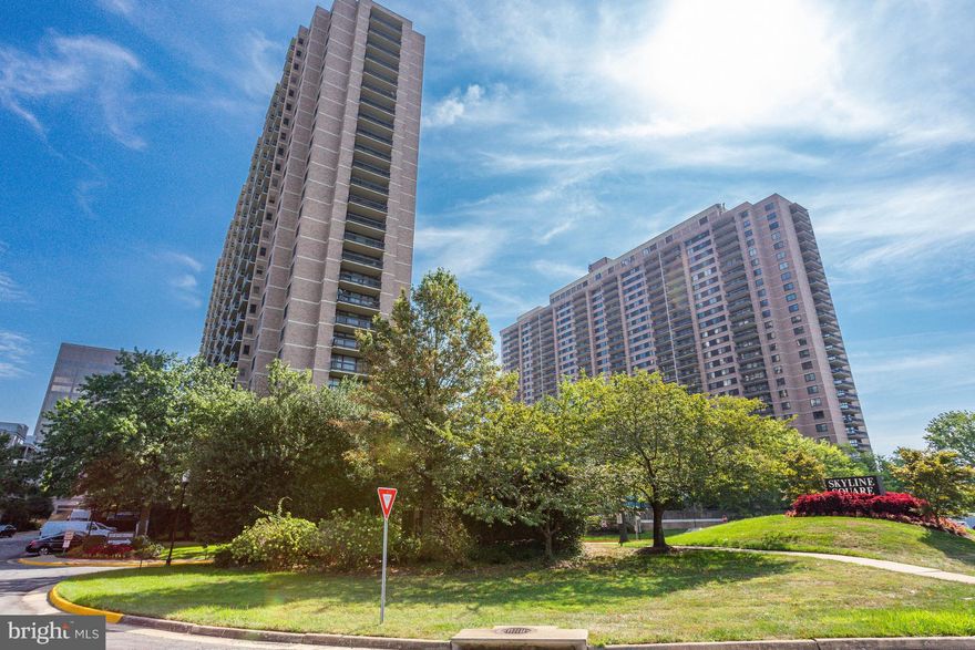 Welcome to Unit 1702-S, situated in the Skyline Square Condominium! This inviting and well-lit condo offers 2 bedrooms, 1 1/2 bathrooms, and a host of desirable features. Perched on the 17th floor, it boasts breathtaking views spanning from National Harbor to Georgetown. Spanning over 1,200 square feet, this unit provides a generously-sized living and dining area, spacious bedrooms, and an oversized patio. The prominent Owner's Suite features an expansive walk-in closet and an ensuite bathroom. The second bedroom showcases built-in storage and captivating skyline vistas. For added convenience, the home is equipped with a washer and dryer. In addition to an assigned parking space, ample guest parking, and a storage space, residents can enjoy a range of amenities such as gyms with saunas and locker rooms, a large outdoor pool, and two billiards and penthouse party rooms. The secure lobby entrance is complemented by 24-hour front desk service. With easy access to Rt 7, 395/495/95, Arlington, Alexandria, National Harbor, and Washington DC, this location offers unparalleled convenience. Acquire this 17th floor unit at a price that allows you to personalize it with the updates of your choice. With a little tender loving care, you can transform it into your dream home. Don't let this opportunity slip away!
