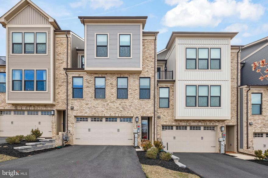 Imagine stepping into one of the premium luxury townhomes in the Longview Ridge community. This move-in-ready residence offers elevated upgrades throughout, beginning with a premium lot perched on a hill that provides a stunning front-facing panorama.

Upon entry, you’re welcomed by a built-in luxury entertainment system featuring in-wall speakers that deliver cinema-style surround sound for an immersive experience. Premium Klipsch speakers are installed across multiple levels, enabling seamless audio transitions throughout the home with multi-zone Sonos control. The basement recreation room—enhanced by ceilings approaching 15 feet—includes a dedicated 5.1 surround sound setup ideal for entertainment.

To support modern living, the home includes multi-level wireless access points for optimized connectivity.

The gourmet kitchen features a spacious island and top-of-the-line Café stainless appliances, including a five-burner gas range, Café Advantium five-in-one oven (convection oven, microwave, toaster oven, warming/air fryer), and a Café single wall oven.

Step outside to one of the largest decks in the community, overlooking natural scenery. A motorized screen transforms the space into an outdoor sunroom—heated or cooled as desired—so you can enjoy the outdoor TV or fireplace in comfort. Below, a fully natural stone patio offers additional space to relax while taking in the surrounding views.

Additional interior enhancements include a brand-new LG washer and dryer, upgraded bathroom finishes with soft-close features, electronic Roman shades throughout the home for personalized light control, and multi-level light dimmers for added ambiance.

For electric vehicle owners, the two-car garage includes a wall-mounted Level 2 Tesla charger (compatible with other EVs using NAC capabilities).

The home also offers convenient access to major commuter routes, dining options, and shopping, including the nearby Hunt Valley Towne Centre.

Key Features:
Top-of-the-line Café kitchen appliances;
Cinema-grade built-in entertainment system with wall speakers;
Multi-level Wi-Fi access points;
Sonos sound system throughout the home (multi-room);
Natural stone patio;
Expanded deck with scenic views;
Move-in ready with motorized Roman shades and light dimmers;
Motorized deck screen for extended outdoor living;
Tesla Level 2 charger in the two-car garage;
Sonos amps, premium receiver/amplifier, premium subwoofer & installed premium TVs (*available for purchase)