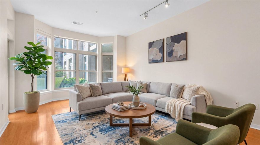 Experience elevated city living at 1209 N Charles, one of Midtown/Mount Vernon’s most coveted luxury condominium residences. Overlooking the beautifully landscaped interior courtyard, this sophisticated two-bedroom plus den residence is filled with exceptional natural light from every room, creating a warm and inviting atmosphere throughout.

Inside, the residence has been thoughtfully updated with a stunning custom European-style kitchen featuring luxury appliances, including a Bosch five-burner gas range, Liebherr refrigerator, Asko dishwasher, new tile flooring, and quartz countertops with an expanded breakfast bar designed for both everyday living and gathering. The large living room features a beautiful bay window that fills the space with light throughout the day, and the versatile den offers ideal flexibility for a home office, library, or more formal dining.

A standout feature of the home is the private patio surrounded by lush greenery and offering direct access to the courtyard itself. Elevated two stories above street level, the space offers a hidden urban garden retreat, equally suited for quiet morning coffee or effortless entertaining.

1209 N Charles offers residents a beautifully maintained courtyard, fitness center, secure entry, and garage parking, all in an unbeatable location, steps from the University of Baltimore, the Baltimore Symphony Orchestra, theaters, cafés, restaurants, and the cultural heart of Mt. Vernon. Just three blocks from Penn Station, with easy MARC and Amtrak access to Washington, New York, and beyond, this is refined urban living with both convenience and tranquility woven seamlessly together.