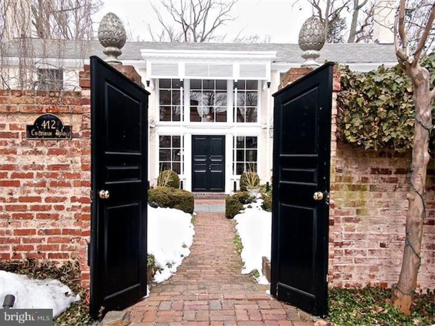 One of a kind property designed by Walter Durham sits on a delightful acre plus of lawns and gardens. The bright and open design will delight, tucked away at the top of a hill, but within minutes of SEPTA station, stores and shops, and the beautiful campus of BM College as well as Historic Harriton House close by. The cobblestone and brick forecourt with mellow brick walls lends European flair. Wrought iron gates protect the driveway which leads to the detached two car garage, with studio apartment with full bath & kitchenette above, useful for inlaws, guests or aupairs.  Enter the house under a rose arbor to soaring ceilings overlooked by a 23' art gallery, bathed with natural & custom lighting. Living room with wood burning fireplace set in a paneled chimney breast with bookshelves. Coat closets and PR, study with big windows and raised log fireplace.  Antique brick-floored dining room with two leaded pane glass doored cabinets.  Entertain in the heated Florida room with tall window walls, intricate brickwork & slate floor opening to the elegant patio and pool area.  Marvellous for plants, parties or just cooling off. Beyond the pool, there is a walled Japanese garden with many specimen trees and plants.  Modern kitchen with granite countertops has all the amenities. You can work with or watch the cook in the sun-filled space.  Desk area and access to basement.  Outside entrance to brick breakfast patio leads to garage.  Step down to a bright family room with eating area and wood burning stove. Outside entrance to the pool and spa.  The floors are tiled and there is room for a ping pong table.  Full bath and laundry room.   A floating staircse rises via second floor gallery leading to the E.B. Mahoney updated master suite with large bedroom overlooking the pool and grounds, dressing area, large walk in closet and spacious modern bath with separate shower and tub.  Second bedroom with private bath.  Third and fourth bedrooms share an updated Jack and Jill bath. There is a study/TV room with storage and built-ins. Linen closets.   Opportunity to own a romantic, manageable mini-estate in a top drawer neighborhood.