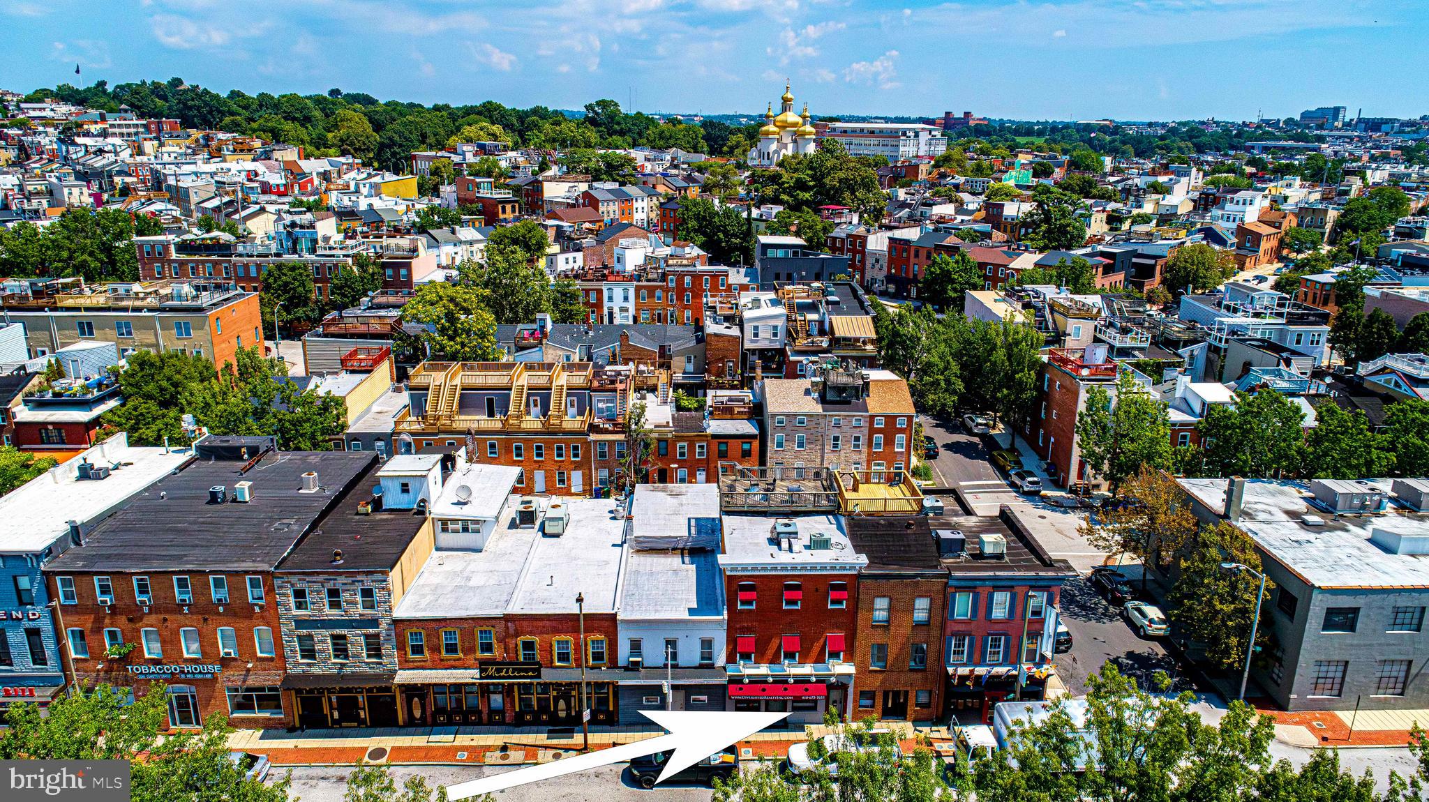 2212-2214 Boston Street is a prime real estate opportunity waiting for you! This property is in a premier location on Boston Street across from the waterfront and North Shore townhomes between Canton and Fells Point with easy access to I-95 as well as downtown Baltimore/Harbor East & Harbor Point. 3 level building comprised of first floor retail/office space and two upper level apartments totaling over 5,200 sqft of finished space. Perfect opportunity for you to operate your business while getting residual income from the 2 rental apartments that generate $2,800/month. Property also has a large roof top deck with panoramic views of downtown Baltimore and surrounding neighborhoods. 3 separate BGE Meters. Reach out for a private tour and more information. A must see!