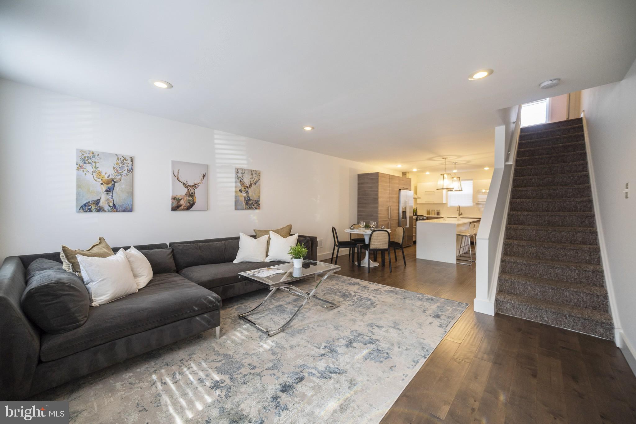 Now available for rent in the heart of Graduate Hospital! This beautiful 3-story brick-front townhome puts you right in the middle of all the dining, parks, and community spots that make this neighborhood one of Philly’s favorites.
Step inside to a bright, open-concept living and dining space with plenty of natural light from two west-facing windows. The modern design features neutral walls, rich dark hardwood floors, and a stunning white quartz island with a waterfall edge—perfect for entertaining or casual family meals. The newly renovated chef’s kitchen is a dream, with tons of storage, specialized drawers for knives and spices, built-in trash and recycling, and sleek stainless steel appliances, including a hidden-panel dishwasher.
Upstairs on the second floor, you’ll find two spacious bedrooms with hardwood floors, great closet space, and a stylish shared bathroom with a tub/shower combo and extra storage.
The third floor is your private retreat! The primary suite level includes a den/home office (which could also make a great nursery), plus a spacious bedroom with high ceilings, two windows, and plenty of closet space. The en-suite bathroom has both a soaking tub and a separate shower, plus even more storage.
Need extra space? The fully finished lower level is perfect for a family room, gym, or guest area—plus, it has a convenient powder room. Outside, the cozy rear patio is ideal for a bistro table, BBQ grill, or even your own little city garden.
This home is just a short stroll from Julian Abele Park and all the great restaurants, bars, coffee shops, and grocery stores of South Street. It is also located within the Marian Anderson Neighborhood Academy catchment and is an easy walk to Rittenhouse Square, University of Penn, CHOP and the Schuylkill River Trail.
No pets. No smoking.