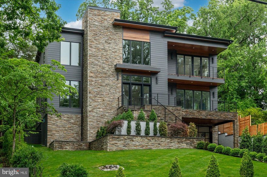 Welcome to this stunning contemporary single-family home located at 5313 Iroquois Rd, Bethesda, MD, in the sought-after Glen Echo Heights neighborhood. This exceptional residence boasts five spacious bedrooms and five and a half luxurious bathrooms. The open and airy design is accentuated by oversized windows, allowing natural light to flood the interior and highlight the beautiful hardwood floors throughout.

The heart of the home is the luxurious chef’s kitchen. Enjoy casual meals at the breakfast bar or in the cozy breakfast nook. The kitchen also features a large island, windowed views, and ample pantry space, catering to all your culinary needs.

Relax in the living area with a gas fireplace, perfect for cozy evenings. The primary ensuite offers a sanctuary with a separate shower, soaking tub, and double vanities. Custom closets in each bedroom provide generous storage options.

Step outside to your private patio and professionally landscaped back yard, ideal for outdoor entertaining or a peaceful retreat. 

Additional features include a full basement with a home gym, a guest bedroom and full bath, extra storage space, and an attached garage for convenience. This magnificent home combines luxury, comfort, and modern amenities, making it a perfect choice for discerning buyers. Don’t miss the opportunity to make this exceptional property your new home. All of this located in the Whitman School Cluster, blocks to the shops of Sangamore and less than 5 miles to Palisades, Friendship Heights, and Bethesda Row Restaurants.