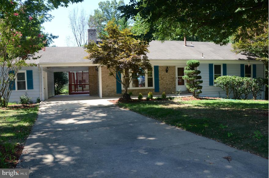 Completely Remodeled & Ready to move in. Bright and Open floor plan! Beautiful remodeled kitchen with granite counter tops & SS appliances. Family Room w/Cathedral Ceilings & Dining room w/Skylights. Hard Wood floor 2 lvl.. Designer Bathrooms. Beautiful deck. Fully finished Walk out basement with patio and large rec room w/FP. Carport w/storage shed. Walk to VRE