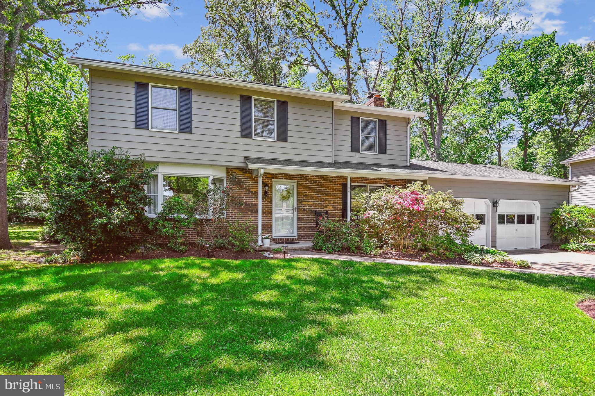 Discover the charm and elegance of this beautiful 4-bedroom, 2.5-bathroom colonial home, perfectly situated in the sought-after water privileged community of Bayberry on the Magothy. This property offers a unique blend of classic design and modern amenities, making it the ideal retreat for those who love a quiet community with the water access life! Four generously sized bedrooms provide ample space for family and guests, with the primary suite featuring an en-suite bathroom with dual sinks and an oversize shower. The formal living room and dining room are perfect for entertaining, while the cozy family room with a fireplace offers a warm and inviting atmosphere. The well-appointed kitchen boasts stainless steel appliances, granite countertops, and a breakfast nook that overlooks the lush backyard. Enjoy year-round comfort in the sun room, which opens to an extensive patio and beautifully hardscaped area, ideal for outdoor gatherings. The meticulously landscaped private yard offers a serene escape, complete with mature trees and garden beds. A propane fueled backup generator provides the assurance of uninterrupted power supply during outages, providing peace of mind. You'll love the oversized 2 car garage with a workbench area and room for cars AND all your stuff! Additional storage is located in an attic above the garage with convenient pull down stairs. A large shed in the backyard keeps all your garden and lawn gear close at hand. Residents have access to a private pier, boat slips, and a sandy beach, perfect for boating, fishing, and swimming. Spriggs Farm Park is located right next door and offers additional water access and a 1.1mi hiking trail loop. Several pool membership options are available nearby, some just a bike ride away! This colonial home is a true gem, offering a perfect blend of luxury, comfort, and access to water activities. Don't miss the chance to make this exceptional property your own!