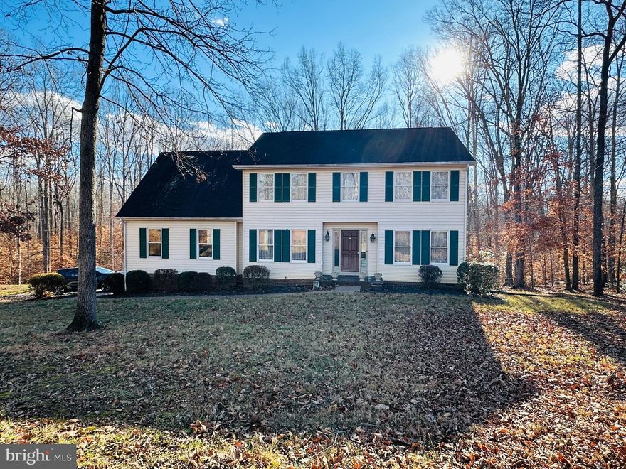 Stately colonial nestled on a private 3-acre lot in Stafford County and... NO HOA!  This 5 bedroom home offers classic charm with an open foyer, formal living and dining rooms, and a spacious family room off the eat-in kitchen.  Main-level laundry adds convenience, while abundant natural light fills the home throughout. Surrounded by mature trees for privacy and tranquility, the property also features a side-load garage. With great bones and endless potential, this home is ready for updating and repairs—an excellent opportunity for investors or buyers looking to customize their dream home!