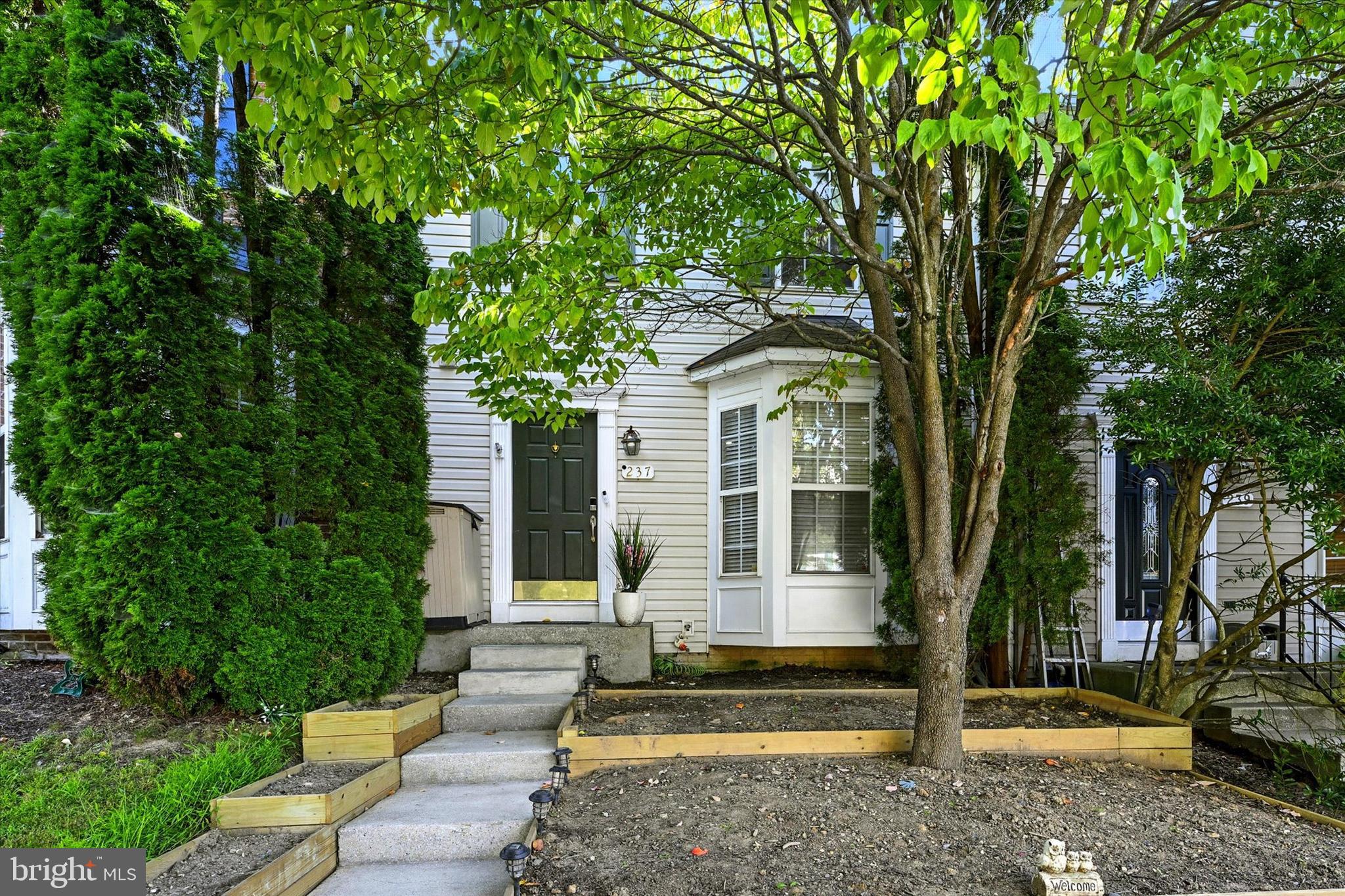 Welcome to 237 Pidco Rd! This beautiful 3-bedroom, 2.5-bathroom townhouse in Reisterstown is move-in ready and filled with modern touches. The main level boasts sleek dark hardwood flooring and recessed lighting throughout, with an open floor plan that seamlessly connects the living room, dining room, and kitchen. The kitchen features stainless steel appliances, a pantry, and a spacious island—perfect for both cooking and entertaining. A convenient half bath completes the main level.
Upstairs, you’ll find three bedrooms, including the primary suite with vaulted ceilings and a private en suite bathroom. An additional full bathroom is located in the hallway. The finished lower level offers a cozy carpeted rec room/family room, providing extra space to relax or entertain.
Enjoy the outdoors on the large rear deck and patio—ideal for gatherings and summer evenings and yard backs up to community playground. Conveniently located near shopping, dining, and commuter routes, this home has it all. Schedule your showing today!
