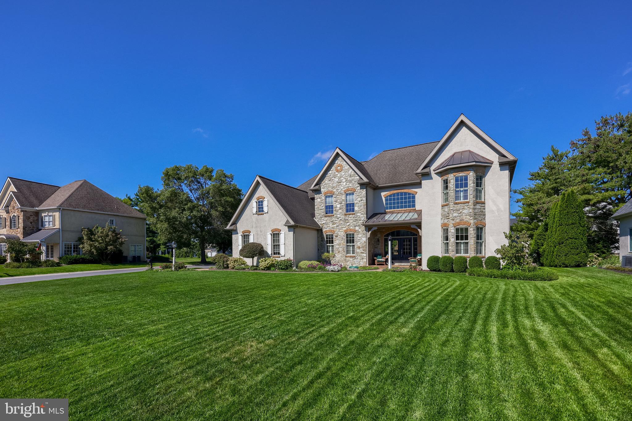 Rates are dropping, don't miss this opportunity. This remarkable Bent Creek home has been cherished by it's original owner since it was built in 2004. An exquisite Costello-build, this dream home offers over 7,400 sq ft of meticulously maintained living space, and is nestled in the most sought-after gated golf course community—Bent Creek. Every inch of this residence reflects thoughtful design and high-end craftsmanship, from the elegant 10-foot ceilings to the gleaming luxurious hardwood floors throughout.
Step into the heart of the home where coffered ceilings crown the spacious kitchen and living areas, creating a grand yet inviting atmosphere. The kitchen is a true culinary masterpiece—an elite gourmet space featuring stunning granite countertops, a double oven, and a striking custom copper hood vent. Thoughtfully designed with every imaginable convenience. The main family room features a custom wet bar and a beautiful fireplace, perfect for entertaining or relaxing in comfort. An additional fireplace in the primary suite adds warmth and charm to your private retreat. The primary en suite bathroom is a spa-like haven, while each of the four additional bedrooms enjoys the convenience and style of Jack-and-Jill bathrooms. Crown molding flows seamlessly throughout the home, and the dramatic staircase makes a striking architectural statement.
Enjoy working from home in the first-floor office, and host elegant dinners beneath the glowing tray ceiling in the formal dining room. Outside, the private backyard oasis is ideal for all-season enjoyment with a beautiful brick fireplace, sprinkler system, and plenty of space for outdoor activities.
Don't miss your chance to be in Lancaster's premier gated community with a newly upgraded golf course, resort-style amenities, and unparalleled privacy.