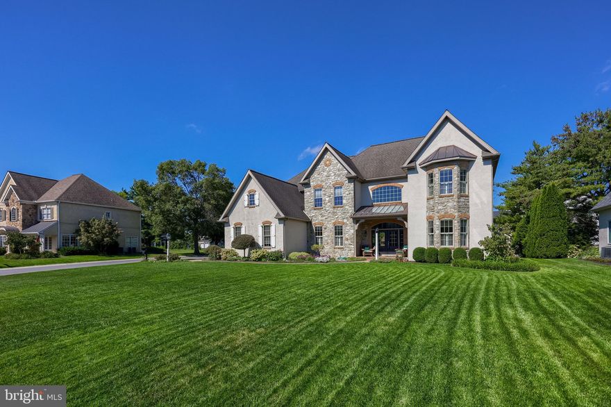 Rates are dropping, don't miss this opportunity. This remarkable Bent Creek home has been cherished by it's original owner since it was built in 2004.  An exquisite Costello-build, this dream home offers over 7,400 sq ft of meticulously maintained living space, and is nestled in the most sought-after gated golf course community—Bent Creek. Every inch of this residence reflects thoughtful design and high-end craftsmanship, from the elegant 10-foot ceilings to the gleaming luxurious hardwood floors throughout.
Step into the heart of the home where coffered ceilings crown the spacious kitchen and living areas, creating a grand yet inviting atmosphere. The kitchen is a true culinary masterpiece—an elite gourmet space featuring stunning granite countertops, a double oven, and a striking custom copper hood vent. Thoughtfully designed with every imaginable convenience. The main family room features a custom wet bar and a beautiful fireplace, perfect for entertaining or relaxing in comfort. An additional fireplace in the primary suite adds warmth and charm to your private retreat. The primary en suite bathroom is a spa-like haven, while each of the four additional bedrooms enjoys the convenience and style of Jack-and-Jill bathrooms. Crown molding flows seamlessly throughout the home, and the dramatic staircase makes a striking architectural statement.
Enjoy working from home in the first-floor office, and host elegant dinners beneath the glowing tray ceiling in the formal dining room. Outside, the private backyard oasis is ideal for all-season enjoyment with a beautiful brick fireplace, sprinkler system, and plenty of space for outdoor activities.
Don't miss your chance to be in Lancaster's premier gated community with a newly upgraded golf course, resort-style amenities, and unparalleled privacy.