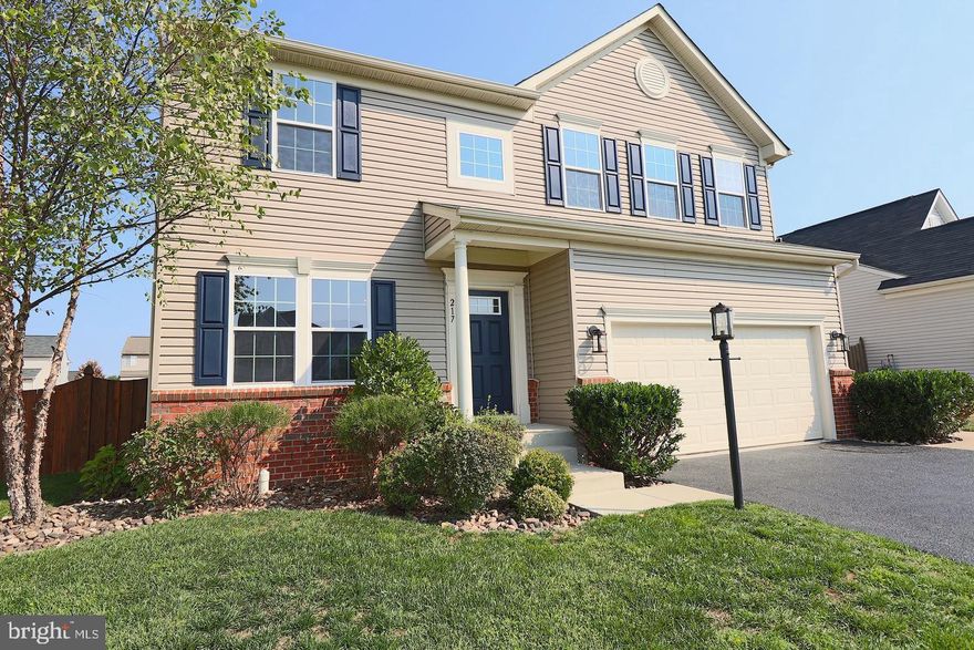 Discover modern living in this fully renovated 4-bedroom, 3.5-bath colonial home located in the sought after Red Bud Run community. This contemporary spin on the traditional floor plan makes a perfect space for entertaining or relaxing at home. The main level's stunning hardwood runs throughout, complemented by a gourmet island kitchen and black stainless appliances. Upgraded cabinets and gleaming granite counters overlook the morning room creating an inviting open concept space to enjoy.  The family room is spacious and functional centered with a spectacular floor to ceiling stone fireplace.  The upper level features neutral palette, updated bathroom vanities, mirrors, light fixtures and waterfall faucets. Fully finished basement with full bath, spacious storage area with built in shelving and double-well walk out to fully fenced back yard.  Custom landscaping, gorgeous river rock, irrigation system, and stamped concrete patio provide an ideal setting for outdoor entertaining.  All in a convenient location off Route 7, close to shopping and entertainment.  Hot tub does not convey, but is negotiable.