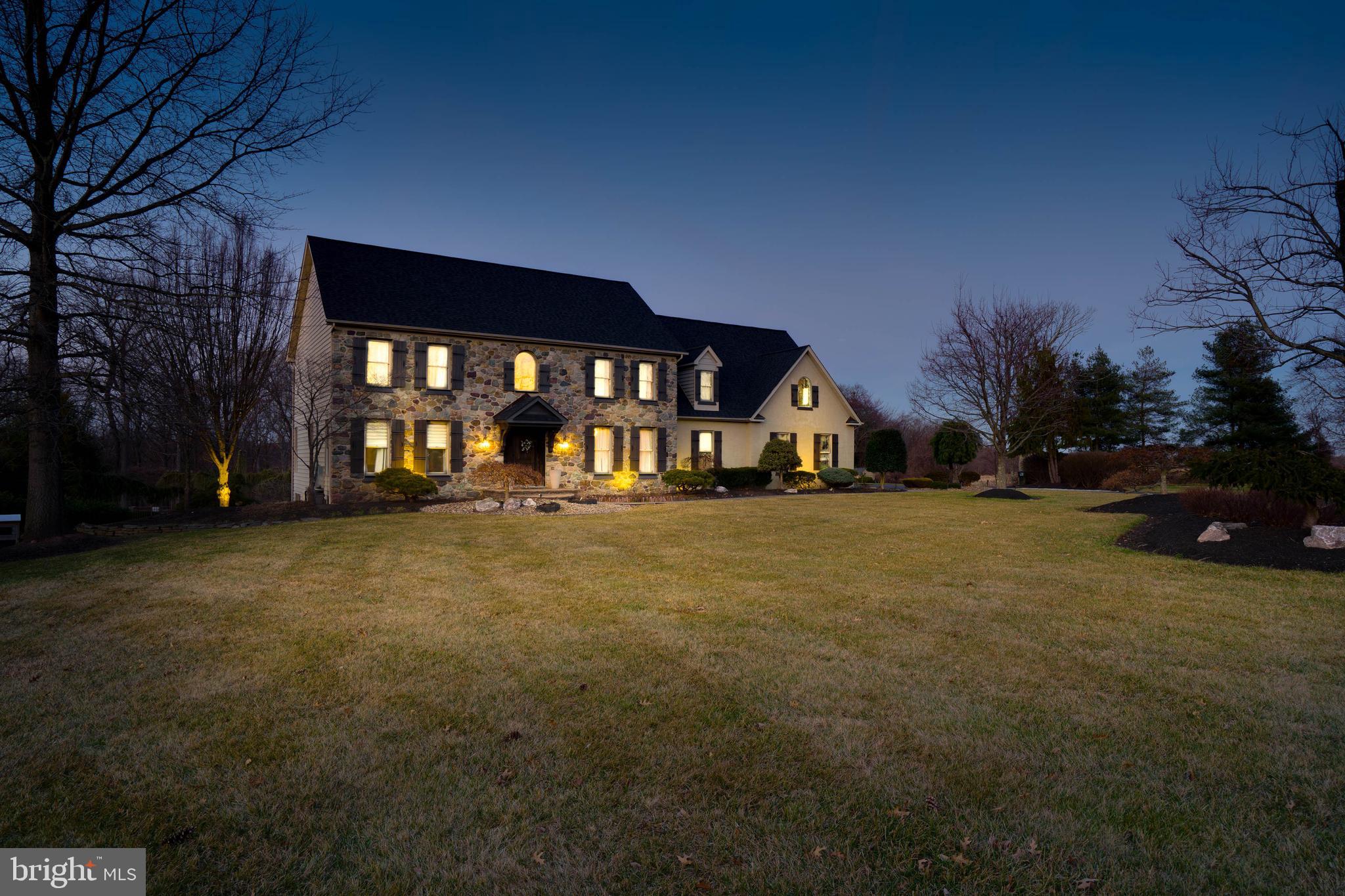 Did you ever think you'd find it all in one package? Rare is the combination of beauty, brains, style, glamour, luxury, and refinement, but this house simply stuns! Resting on 7.69 acres and neatly situated on a cul-de-sac, this 6440 sq ft luxurious abode stirs the imagination. Driving the 470' winding driveway, it's almost reminiscent of the charm and mystery of an English estate. Your imagination grips you at every curve as you navigate your way past varieties of lush hardwood trees and manicured shrubbery. Vernacular architecture is echoed with the use of stone reflecting traditional, European styles. Entering the professionally decorated and renovated home, you will be in awe of the two-story grand foyer and sitting area. Light delicately dances throughout the sumptuous space and shines magnificently in response to the opulent, six-foot tall Swarovski Crystal chandelier. Discover a cozy living room full of class with hardwood floors, crown molding and detailed baseboards. Adorned with fanciful touches, including wainscoting, and a chandelier, the formal dining room exudes sophistication. Moving onto the family room, the vast expanse of the two-story space is simply breathtaking and is further magnified by vaulted ceilings, wooden beams and the stone wood-burning fireplace. The kitchen is designed for the preparation and enjoyment of even the most complicated of haute cuisine, while maintaining the practicality of everyday use. Several state-of-the-art Frigidaire Professional grade stainless steel appliances, including an enormous 64' wide refrigerator were installed about one year ago! Earth-toned and slightly glinting granite countertops sprawl and bedeck the updated cabinetry with form and function. In addition, the kitchen's large eating area overlooks the remarkable family room and awe-inspiring backyard! Stepping onto the new TREX composite deck, you'll feel the quality of construction. The two-tone deck features a staircase leading down to the picturesque backyard. Enjoy the grilling station, surround sound music, fenced-in pool area, and the paver pool patio. Going back into the home, make your way to the second-floor master bedroom via the split-staircase. Featuring a deep angled tray ceiling and a separate full sitting area, the master bedroom is fit for the most perceptive of fine taste. Slipping into the Roman-styled walk-in shower with vaulted ceilings, grooming becomes more of a spa experience. Pop open a bottle of your favorite champagne to celebrate a business or life success, or sip a glass of wine, while enjoying the soothing effects of the jacuzzi water jets and the surround sound. The massive His & Hers walk-in closets are outfitted with cabinetry from floor to ceiling. Three additional bedrooms are located on the second floor. Two bedrooms intelligently share a dual-vanity, Jack and Jill bathroom. The other bedroom is a princess suite with a full bathroom and walk-in closet. Make your way to the basement dreams are made of! Everyone can easily gather for drinks, games, food and laughter around the full-service wrap-around bar. The ultimate basement is topped off with walk-out doors to the backyard, new tile flooring, a hobby room, entertainment room, exercise area with custom gym flooring, newer full bathroom, and a newer two-person sauna! Other features include 2-zone HVAC, entire roof replaced four years ago, new LG washer and dryer, new hardwood floors throughout, all 4.5 bathrooms are updated, updated office, new deck and much more! Located near Tyler State Park, Village of Newtown, and the highly coveted Council Rock School District, this home has all the advantages. It even has easy access to Philadelphia, New Jersey and New York. No other property on the market rivals or approaches the luxury or beauty of this home. With so much to offer, it will not last long!