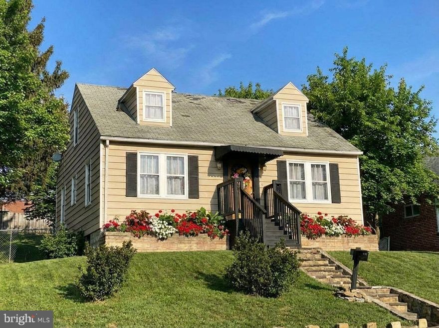 Welcome to your charming cape cod home, situated on a double lot, in the picturesque mountains of Western Maryland.  This home is located in close proximity to both middle and high schools. This remodeled residence features three cozy bedrooms and one beautifully updated bathroom, with a fenced-in back yard and off-street parking.  As you step inside, you'll find a quaint kitchen that boasts a large center island and pass-through, allowing seamless service to the adjacent living room - making this space ideal for entertaining. The exposed brick flue between the kitchen and dining room adds unique character to the rooms, and is complemented by decorative wood planks adorning the back wall and ceiling. The gleaming hardwood floors throughout the home create warmth, while the faux painting on the second floor adds a touch of charm.  The updated bathroom on the main floor features a luxurious walk-in ceramic tile shower, with a built-in seat for convenience. Step out onto the back porch and you will find an inviting spot to relax on the swing, enjoying peaceful summer evenings. Take notice of the various intricate wall hangings throughout the home, that were made from original pieces of this house. You won't want to miss this delightful home. Call Today to Schedule a Tour!!!
