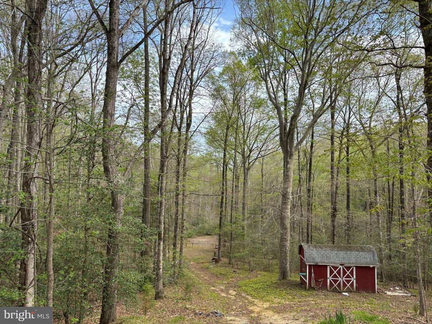 15.42 acres of serenity await!  Located just minutes from shopping, restaurants, etc., BUT far enough off the beaten path to offer seclusion, privacy, hunting and acting as a retreat from the hustle and bustle of everyday life. Move in ready with fresh paint and new flooring throughout.  Potential 5th and 6th Bedrooms in basement.
