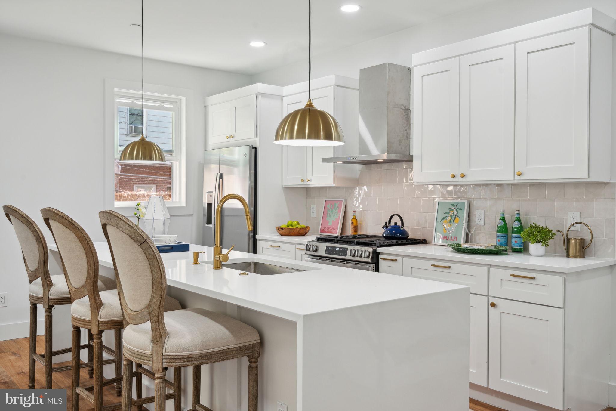 Welcome to 42, 44, and 46 Good Street—a unique collection of three newly constructed townhomes brought to you by a local boutique builder. This detached model unit offers over 3,300 sq ft of thoughtfully designed living space with modern finishes.
Upon entry, you'll be welcomed by soaring 9’+ ceilings and a light-filled living room complemented by custom millwork. The open floor plan flows seamlessly, with white oak engineered hardwood flooring throughout, creating a warm and inviting atmosphere.
The gourmet kitchen is a chef’s dream, featuring stainless steel appliances, quartz countertops, a stylish contemporary backsplash, and classic white shaker cabinetry. Elegant gold pendants illuminate the spacious island, while brushed gold hardware adds a touch of sophistication.
The second floor offers two generously sized bedrooms, a convenient laundry area with stacked washer and dryer, and a versatile flex space—ideal for a home office, media room, or can be closed off for an additional bedroom. A full hall bathroom with a deep soaking tub completes this level.
The third-floor primary suite is a sanctuary, complete with custom millwork, custom walk-through closet and an en-suite bathroom featuring a dual vanity and a frameless glass walk-in shower. This level also includes a wet bar with a beverage cooler and a versatile bonus area, perfect for enjoying your morning coffee or unwinding with evening cocktails.
The finished lower level provides a fourth bedroom and abundant extra space for a home gym, additional storage, or even more bedrooms, allowing you to tailor it to your needs.
Enjoy outdoor living on the rooftop deck with 360º sunset views, finished with Trex decking for a low-maintenance, high-quality experience. The fenced backyard with lush grass is perfect for relaxing or entertaining guests.
Additional features include a tankless hot water heater, lifetime warranty on windows, and a durable exterior with Hardie board and vinyl siding, complemented by a stately white brick façade.
This home comes complete with a full 10-year tax abatement and a 1-year builder warranty.
Situated just blocks from the vibrant Germantown Avenue commercial corridor, this property offers easy access to Chestnut Hill, Center City, major transportation routes, and Fairmount Park. Experience the best of West Mt. Airy—a charming, tree-lined neighborhood known for its historic architecture, cultural diversity, and close-knit community feel.