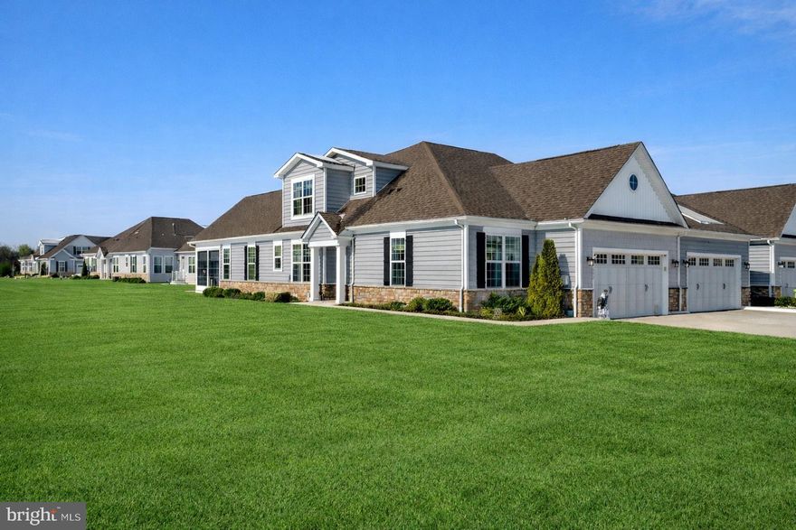 Welcome to effortless Eastern Shore living in this beautifully appointed 3-bedroom, 3-bath Oxford model, located in one of Kent Island’s premier and coveted active adult communities, Bay Bridge Cove. Perfectly positioned on a large, premium lot, this home offers a low-maintenance lifestyle paired with thoughtful upgrades, flexible living spaces, and access to outstanding community amenities.

Inside, you’ll immediately appreciate the open floor plan, designed for both everyday comfort and easy entertaining. The entire interior has been professionally painted, creating a fresh backdrop that is truly move-in ready. Natural light fills the main living areas, enhancing the sense of space and flow that makes the Oxford model so highly sought after.

One of the home’s standout features is the screened porch with EZ-Breeze windows, allowing for four-season enjoyment. Whether you’re enjoying morning coffee, relaxing with a book, or entertaining guests, this versatile space feels like an extension of the living area year-round. The flanking private deck offers additional outdoor space for grilling or enjoying the peaceful setting.  The outdoor areas are equally well designed, featuring paver walkways, a full irrigation system, and landscape lighting that enhances both curb appeal and evening ambiance. These features provide beauty without the burden of high maintenance.

The main level offers comfortable living with a generous en-suite bedroom and bath as well an additional bedroom and bathroom space, while the second level adds exceptional flexibility. Upstairs, you’ll find a full bedroom and full bathroom, along with a loft area and a dedicated office, making it ideal for guests, hobbies, or working from home. This thoughtful layout provides privacy and versatility rarely found in condominium living.

Additional highlights include a two-car garage with epoxy flooring, offering a clean, polished space for parking, storage, or projects. Every detail reflects pride of ownership and careful upkeep.

Living here means enjoying a vibrant active adult community with outstanding amenities, including a swimming pool, tennis courts, walking trails, and a welcoming clubhouse that hosts social activities and events. Whether you prefer staying active or simply relaxing, there’s something for everyone.

The location is hard to beat—just minutes from Route 50 for easy access to Annapolis, Baltimore, Washington, D.C., and the beaches, while still surrounded by the charm of Kent Island. Enjoy close proximity to restaurants, shopping, and waterfront dining, including popular water-oriented restaurants known for fresh seafood and scenic views.

This home offers the perfect combination of comfort, convenience, and community in one of Kent Island’s most desirable settings. A rare opportunity to enjoy refined, low-maintenance living with space, style, and location all working in your favor.