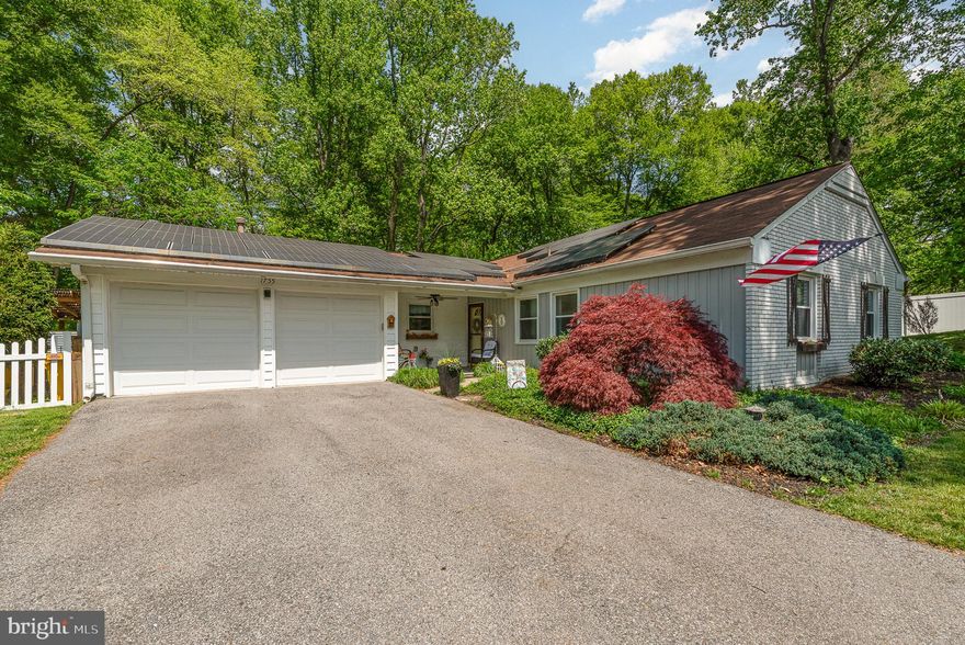 BEST AND FINAL OFFERS ARE DUE ON 8/16/2024 AT 8 P.M. This beautifully upgraded rancher offers a rare blend of style, privacy, and everyday convenience. Ideally located within walking distance to the local elementary school and just minutes from shopping, dining, and entertainment, the home is perfectly situated on a quiet lot that backs to a golf course and mature trees, offering peaceful views and a tranquil setting.

Inside, the home features engineered hardwood flooring, elegant 5” baseboards, recessed lighting, and updated 6-panel doors and closets for a cohesive, modern feel. The main living area centers around a stunning Osborn fireplace with blowers, framed by a custom stone wall and upgraded mantle, adding warmth and character to the space. The kitchen has been tastefully updated with white quartz countertops, a sleek black sink workstation with a modern faucet, new stove/oven and refrigerator, and custom blinds.

A standout feature is the expanded laundry center, thoughtfully designed with soft-close white cabinetry, a stylish gray tile backsplash, and an efficient stacking washer and dryer — combining functionality with designer flair.

The backyard is a true retreat, perfect for both entertaining and relaxing. A covered patio includes a ceiling fan, built-in lighting, bar, and mini fridge, while a 7-person hot tub offers a luxury spa experience. The yard is enclosed with white vinyl fencing and includes a dedicated dog run, all set against the backdrop of mature trees and scenic golf course views.

Additional upgrades enhance both comfort and curb appeal, including new vinyl siding, custom shutters, window boxes, and tiled front porch flooring. The primary bedroom features a custom closet system, while the primary bathroom has refreshed hardware and finishes. Ceilings in the kitchen and living room have been newly repainted, completing the home's polished interior.

Combining thoughtful updates, designer finishes, and a serene location, this home is a rare find that offers effortless living both indoors and out. Come check it out today!