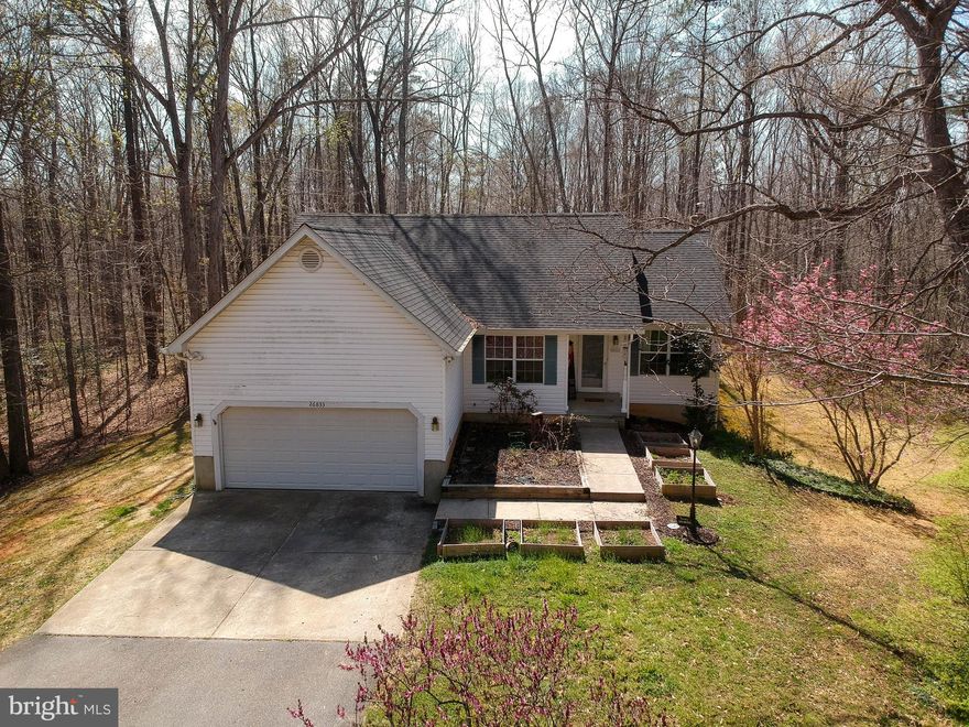 Nestled on a secluded 13± acre lot in Mechanicsville, MD, this charming rambler offers the perfect blend of comfort, privacy, and modern updates. The beautifully renovated kitchen features stainless steel appliances, butcher block countertops, stylish two-tone cabinetry, and a welcoming breakfast island—ideal for everyday living and entertaining. The main level includes three spacious bedrooms and two full bathrooms, while the lower level offers an additional bedroom and full bath. Buyers have the flexibility to choose their ideal primary suite—either the main-level bedroom with an attached bath or the expansive lower-level suite complete with a cozy pellet stove. Enjoy multiple living spaces, including a bright living room just off the kitchen and a comfortable family room on the lower level. Step outside to unwind on the rear concrete patio or relax in the hot tub overlooking the peaceful, partially wooded backyard.  Additional features include two storage sheds that convey with the property, along with a recently replaced roof and HVAC system for added peace of mind. Don’t miss your chance to own this private country retreat!