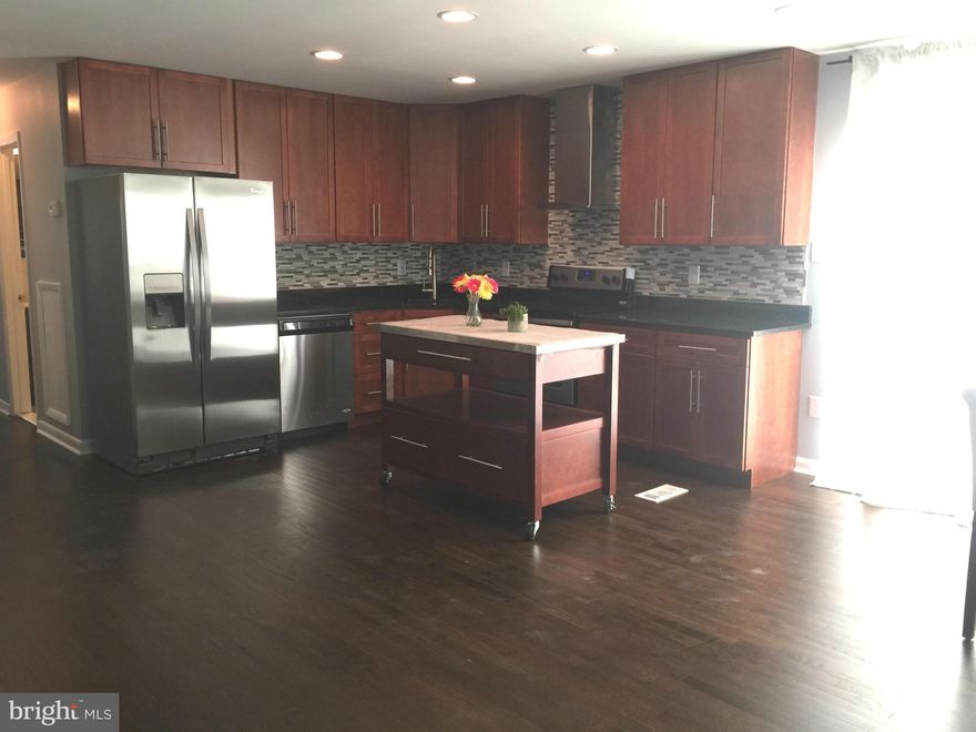 Beautiful Rambler completely renovated.  Corner lot with fenced rear yard.  Refinished Hardwood floor on main level.  All new kitchen, new cabinets, new granite countertops, upgraded appliances, kitchen island.  Spacious Master Suite with full bath. New baths. New windows. New HVAC.  Finished waterproof basement with sump pump, cozy wood burning fireplace, two roomy bedrooms and a new full bath.