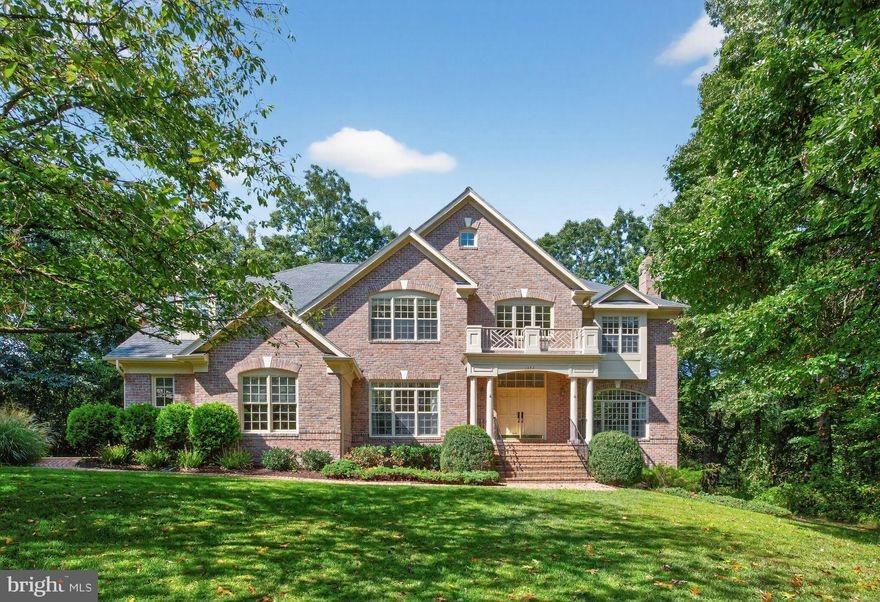 Welcome to this sun-filled, all-brick colonial built by GP Homes, tucked away on a quiet cul-de-sac just mins from Tysons, Route 7, the Toll Road, and the Beltway. Resting on nearly an acre (0.83-acre lot), this stately residence offers over 7,500 square feet of living space with 7 bedrooms, 5 full baths, 2 half baths, and a 3-car garage, crafted for both comfortable family living and effortless entertaining. The main level features a welcoming portico entry and a dramatic two-story marble foyer, with the formal living room to the right and the dining room to the left. At the heart of the home is an elegant two-story family room with soaring ceilings, a fireplace, and walls of transom windows. A sun-filled private study with built-ins offers the perfect work-from-home retreat. The gourmet kitchen is appointed with granite counters and a spacious breakfast area that opens to the deck, while dual powder rooms and a convenient laundry complete this level. Upstairs, the grand primary suite includes a sitting room with a double-sided fireplace, tray ceiling, custom built-ins, and a spa-like marble bath with whirlpool tub, shower, and oversized walk-in closet. Three additional bedrooms and two full baths complete the upper level. The walk-out lower level expands the living space with a large recreation room, fireplace, full-size windows, a granite-topped bar, and three additional bedrooms with two full baths. Recent updates include a brand-new roof, refinished hardwoods, polished marble, freshly stained deck, and complete interior and exterior painting. The lot extends to the left of the property, offering wonderful potential for additional landscaping, hardscaping, or a swimming pool. Come tour this spectacular McLean residence and discover your future home!!