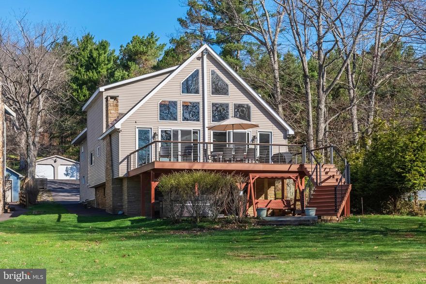 Escape to this charming lakefront retreat “Linger Longer” featuring a private type “A” dock, level waterfront, and stunning water views. Offering five bedrooms, an open floorplan, great loft area, and a game room, this home has plenty of space to spend time with family and friends. Enjoy peaceful mornings by the lake, afternoons on the water, and evenings in the hot tub and by the fire. The outdoor space includes a spacious lakefront deck that is perfect for simply unwinding after a day of boating, fishing, and enjoying all that Deep Creek Lake has to offer. The rear lot includes detached garage space for all your recreational toys. There is also a whole-house generator in the event you would need backup service. Glen Cove is a coveted spot at the lake, and this home is at the end of a dead-end road, providing excellent privacy. And the centralized location puts you super close to restaurants, shopping, cinema, coffee shops, DCL State Park, and golf courses.