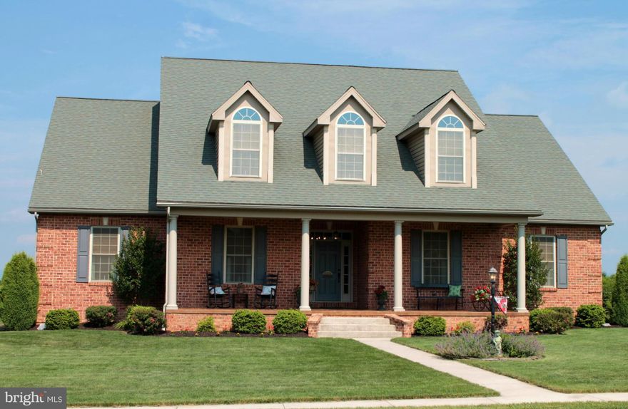 Custom brick home in Heritage Estates. Stamped concrete covered front porch & covered rear patio w/gas hook-up for grill. Oak hardwood flrs & tile floors on main level. Main level laundry room. 2-story great room w/stacked stone gas fireplace. 2nd floor family room w/3 dormers and custom wood ceilings. spacious 22x44 foot 3-car garage. Master Suite with his/her walk-in closets and deluxe bath.