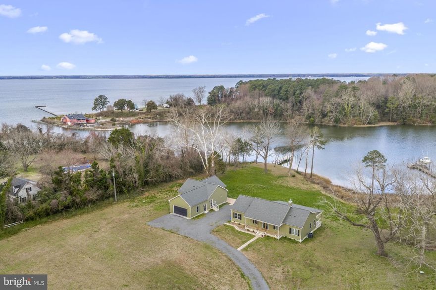 Enjoy effortless waterfront living on Greenvale Creek, just off the entrance to the Rappahannock River. The main residence offers 3 bedrooms and 2.5 baths across 1,620 square feet with an open floor plan, fireplace, and a spacious waterside deck with sleek cable railing spanning the length of the home, perfect for taking in the views.  A separate 1-bedroom guest house with 1.5 baths features a full kitchen, sunroom, private waterside deck, and attached 2-car garage, ideal for guests or extended stays. The protected shoreline with rip rap and marsh grasses complements a private pier with approximately 4’ MLW, offering easy boating access to area spots like Urbanna’s town dock, restaurants, and shops, as well as nearby Yankee Point Marina and The Tides Inn on Carter's Creek.  A complete waterfront package offering comfort, flexibility, and prime access to the Rappahannock River lifestyle.