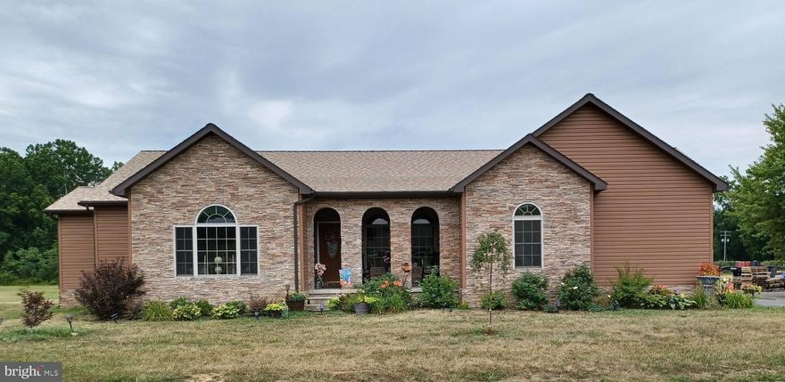 Stunning Stone & Siding Single Level Contemporary Home Nestled on A Premium Approx 1.5 Acre Level Lot.
Superior Quality Features Abound :  Granite Counter Tops; Granite Window  Sills; Tray Ceilings; Recessed Lighting; Fireplace; Huge Walk in Closet in Master Bedroom Suite;  Beautiful Open Floor Plan: Bosh 95% Hi Efficiency Heating System;  Private Deck to Relax and enjoy the View.  A must see to Appreciate this Spectacular Home. Creekside Manor Subdivision also has a Community Picnic Area By the Creek for your enjoyment.