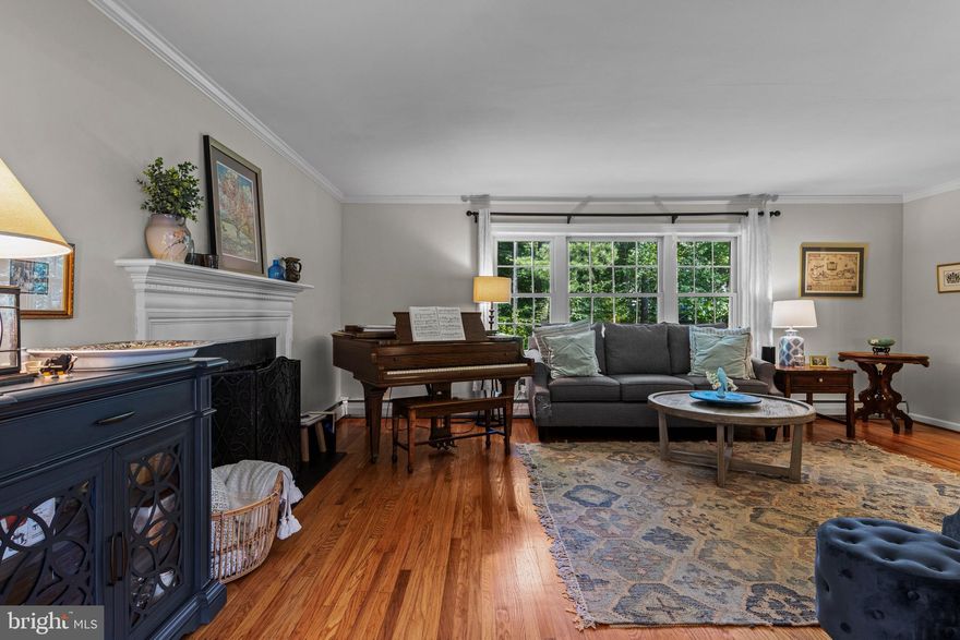 Move-in Ready – Check. Beautifully renovated– Check. Spacious and Welcoming – Check.
This home, Situated on a large and tranquil lot, truly has it all. Featuring 4 generously-sized bedrooms, 3 full baths, and a powder room, it offers comfort and flexibility for every lifestyle. Upon entry, you're welcomed by a large fireside living room that flows seamlessly into the open-concept kitchen and dining area. The kitchen is well-appointed, and dining area has  stylish new built-ins that provide both wine storage and visual appeal. Step outside from the dining area onto a durable, high-quality deck—ideal for entertaining or relaxing. The lower-level family room boasts a brand new built-in mini wet bar and refrigerator, a convenient powder room, and a spacious mudroom that includes laundry, additional storage, and a desk area—perfect for busy households. Three of the bedrooms offer generous space and great storage, while one features an en suite bath, ideal for guests or multi-generational living. The top floor is a true retreat, showcasing a fabulous primary suite with a huge walk-in closet/dressing room; a spa-like bath with double sinks, a large shower, & linen closet; and a charming sitting area with window seat—a perfect nook to read, write, or unwind. Heated and cooled with Geothermal.  Located within walking distance to the elementary school and conveniently situated for easy access to everything Wayne has to offer, this home combines functionality, beauty, and an unbeatable location. Buyer to confirm square footage.