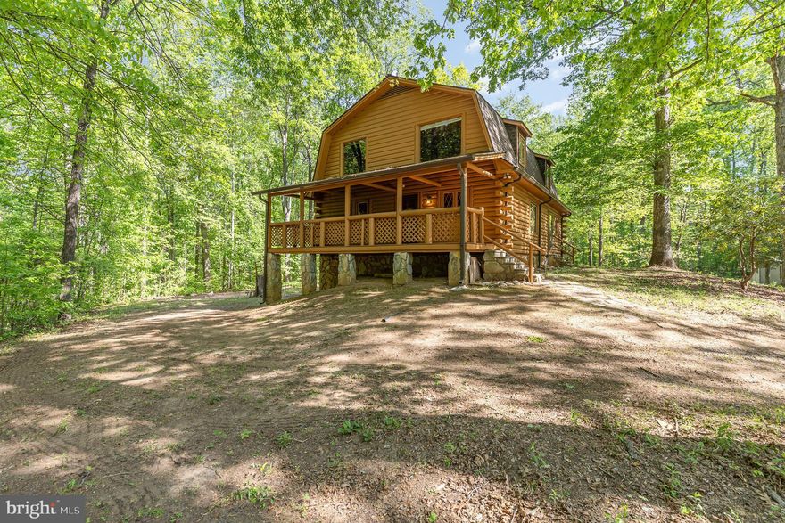 Discover this charming and secluded log cabin, boasting three bedrooms and two full baths, all nestled on over four picturesque acres. This enchanting home features a cozy wood-burning stove, perfect for warming up on cold evenings, and wood floors that add to its rustic appeal. Experience nature at its finest while enjoying the serenity this cabin provides! A blank canvas simply waiting for someone to put their personal touches! Additional adjoining  2.906 acre lot (not listed in MLS0 available for sale with the property.